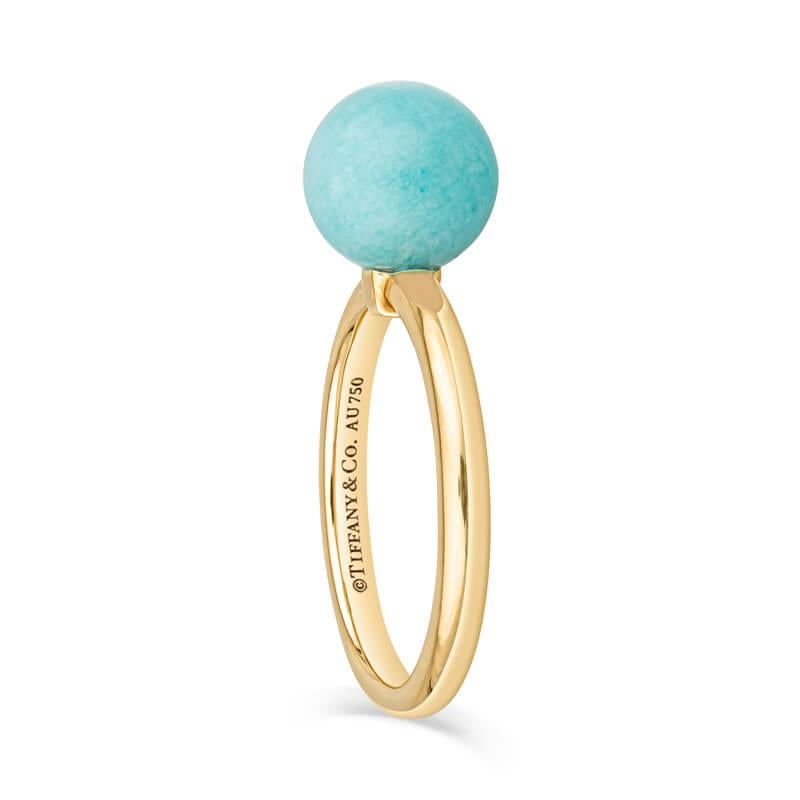 A beautiful and delicate ring featuring an 8mm Amazonite stone set in 18 karat yellow gold. Wear this ring alone or stack it with others! Please note this is a natural stone and some variations will occur. This ring is currently sized to a 4.5 but