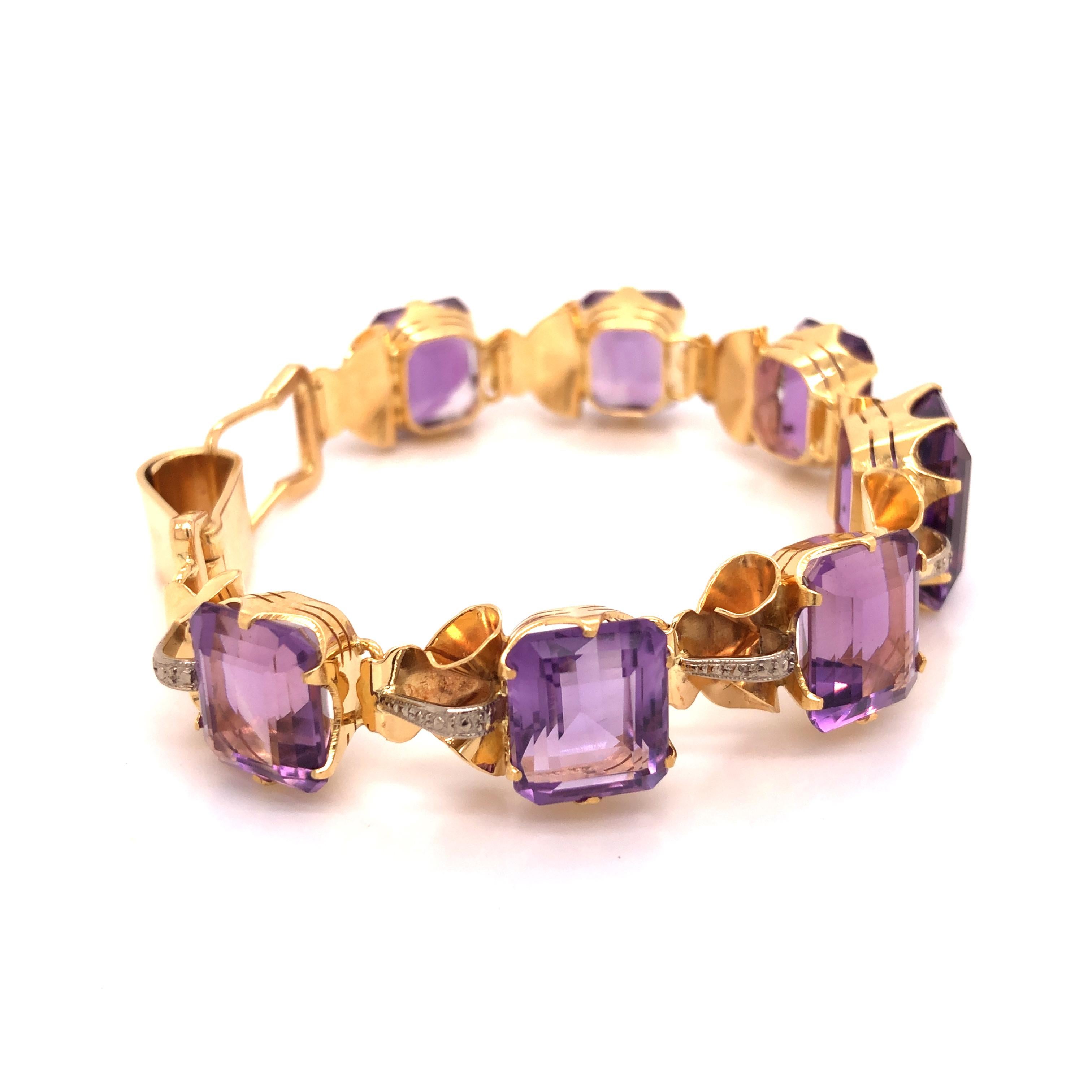 This gorgeous vintage bracelet contains 7 amethyst stones set in 18K yellow gold. The center amethyst measures 12.30 mm x 15.10 x 9.45.

Weight: 32.9 grams
