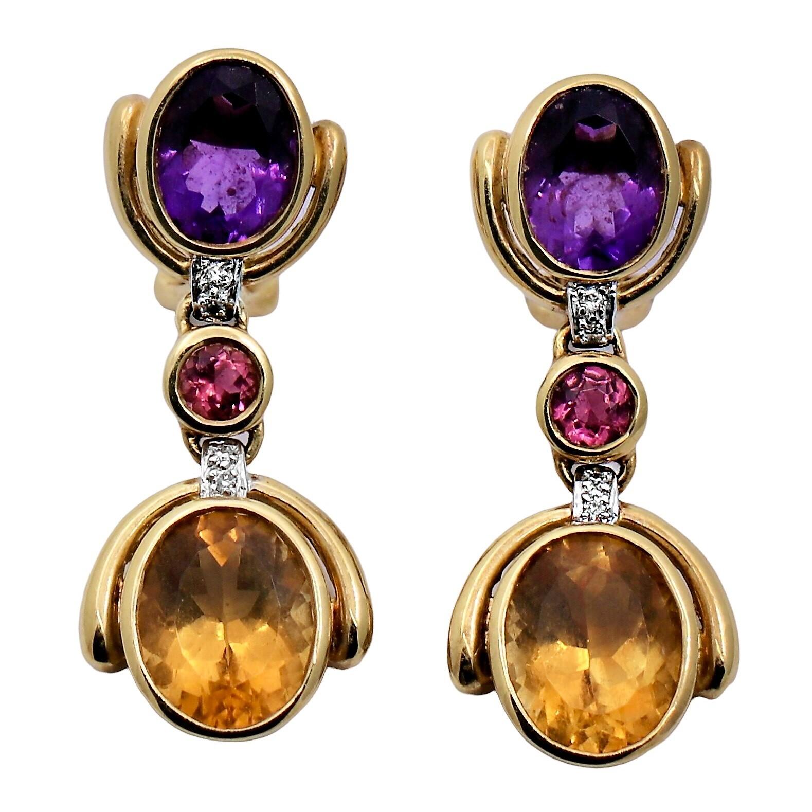 This versatile pair of late-20th century 18K yellow gold dangle earrings are constructed with invisible hinges between each panel so that they have movement when worn. Each earring is bezel set with one natural Amethyst, one golden Citrine and one