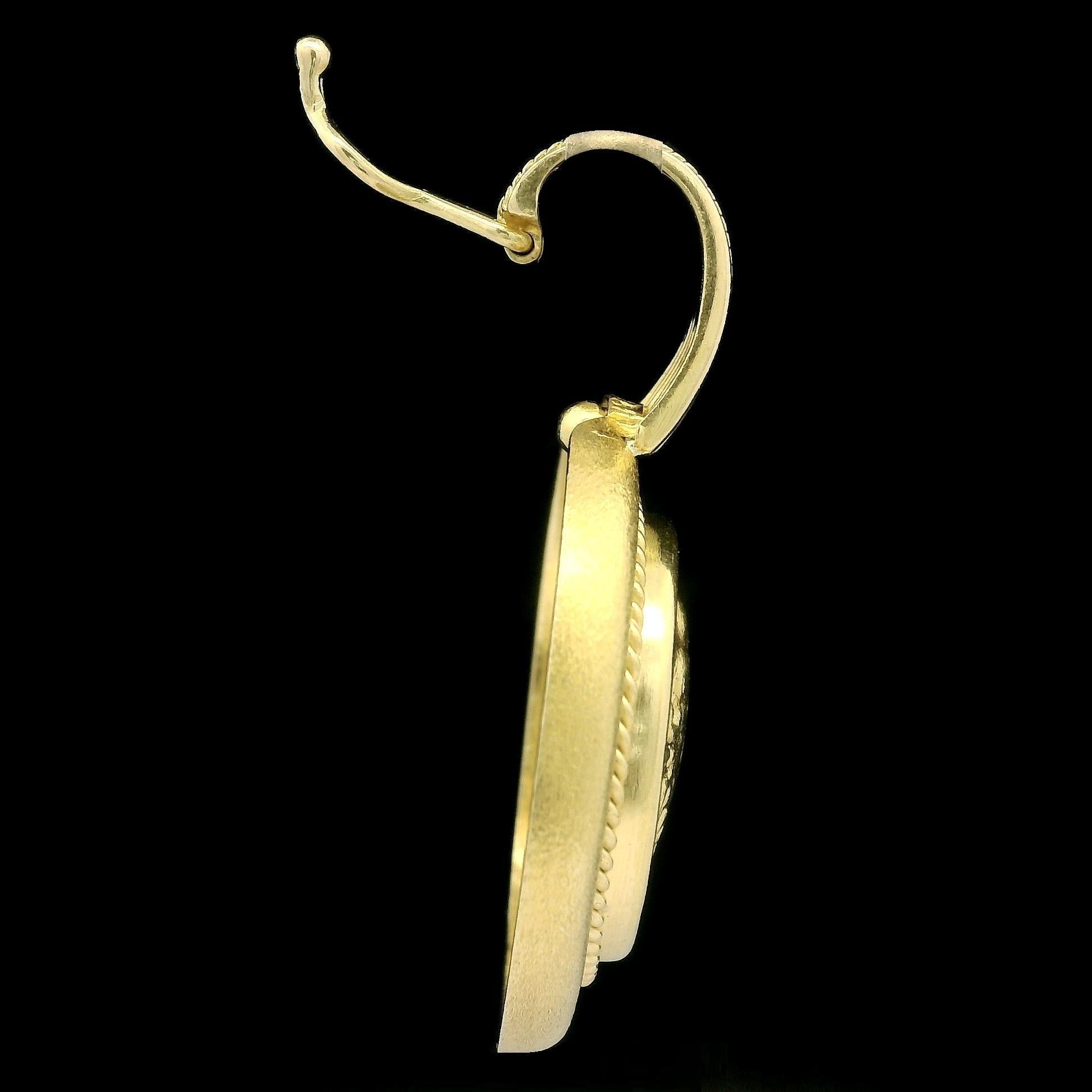 Material: Solid 18k Yellow Gold
Weight: 22.18 Grams (total)
Pendant Height (w/ bail): 40.7mm (1.6