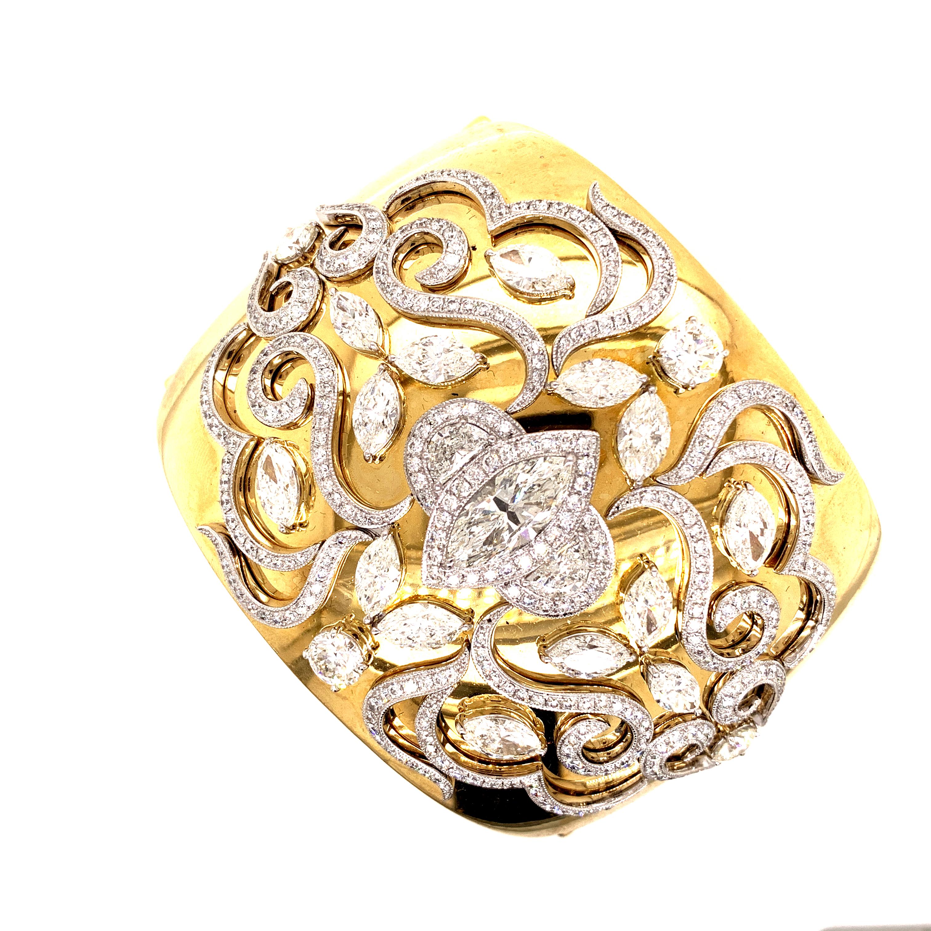 18K yellow gold bangle designed with small diamonds with the total weight of 4.18 carats along with marquise diamonds that weighs 10.15 carat and marquise center stone that weighs 2.20 carat.

Sophia D by Joseph Dardashti LTD has been known