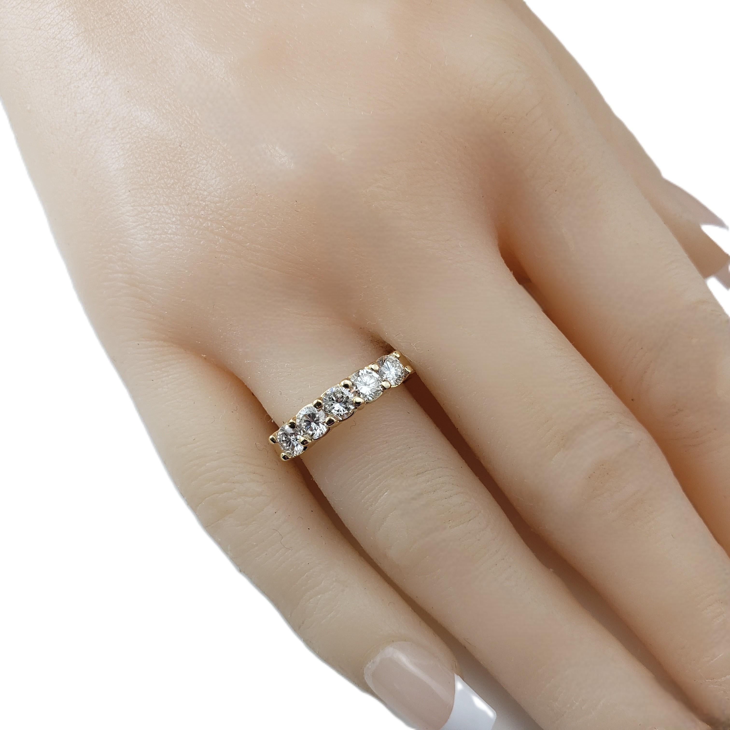 18K Yellow Gold and 5 Diamond Band Ring Size 8

This sparkling band features five round brilliant cut diamonds set in classic 18K yellow gold.

 Width: 4 mm.

Approximate total diamond weight: 1.00 - 1.10 ct.

Diamond color: G

Diamond clarity: