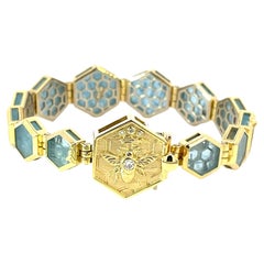 Bracelet hexagonal en or jaune 18 carats et aigue-marine avec détails en forme d'abeille