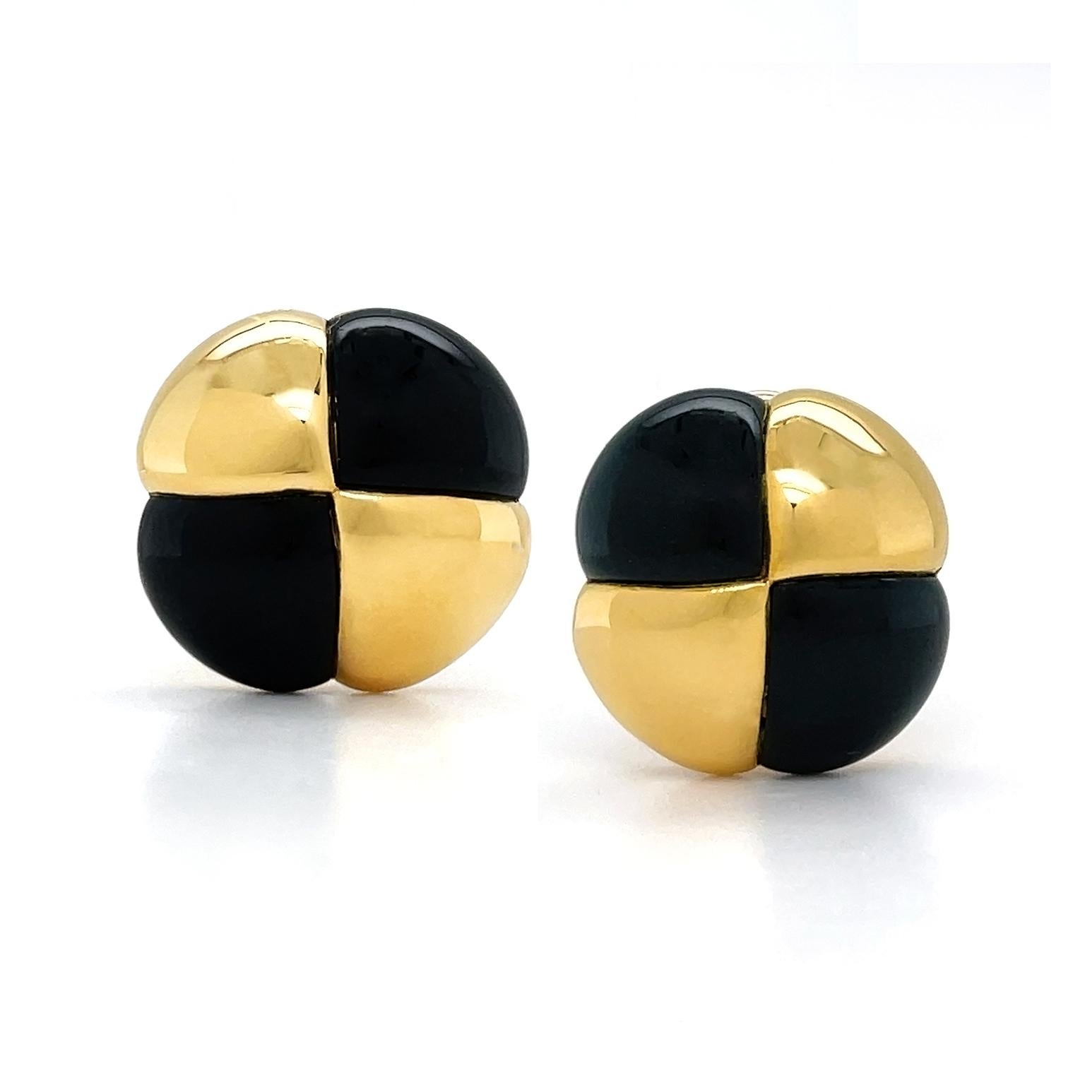 A checkerboard design is created by the highlight to black jade. Black jade carved into wedges with a rounded top are embedded with polished 18k yellow gold in the same cut. Together, the yellow gold brings light and the black jade brings