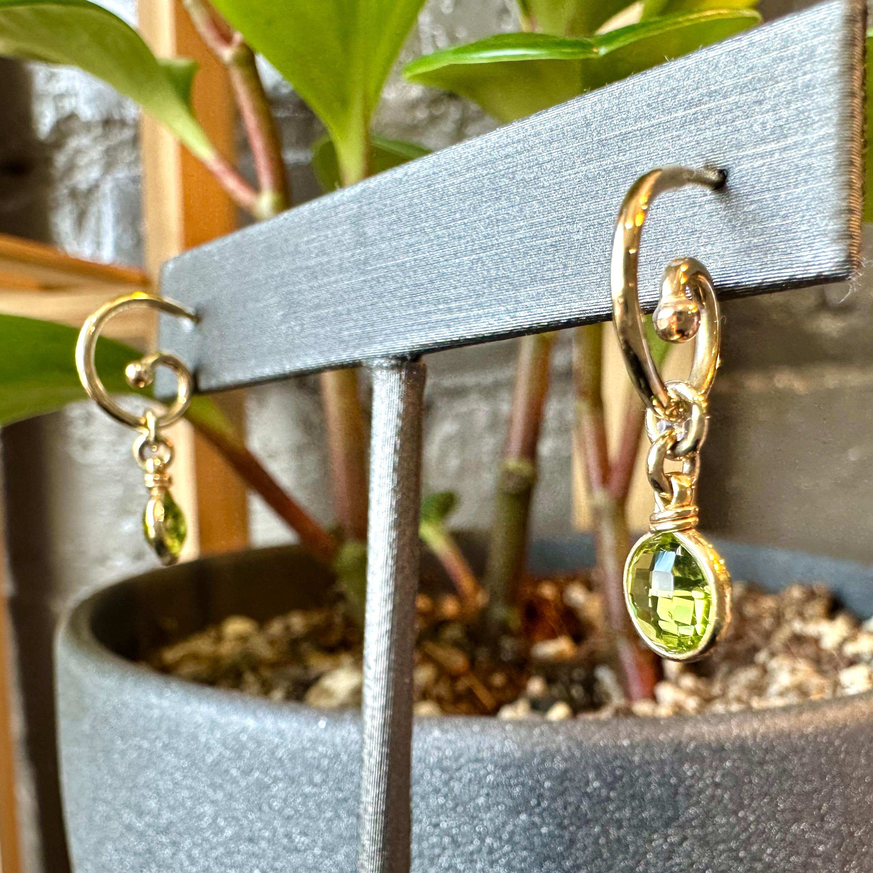 These 14k yellow gold hoop hand shaped earrings were named for and crafted to symbolize Growth, spiraling in like delicate fiddle heads ready to unfurl. Mary Elizabeth, of Glitter and Gold Studio, chose double sided checkerboard cut (Capri cut)