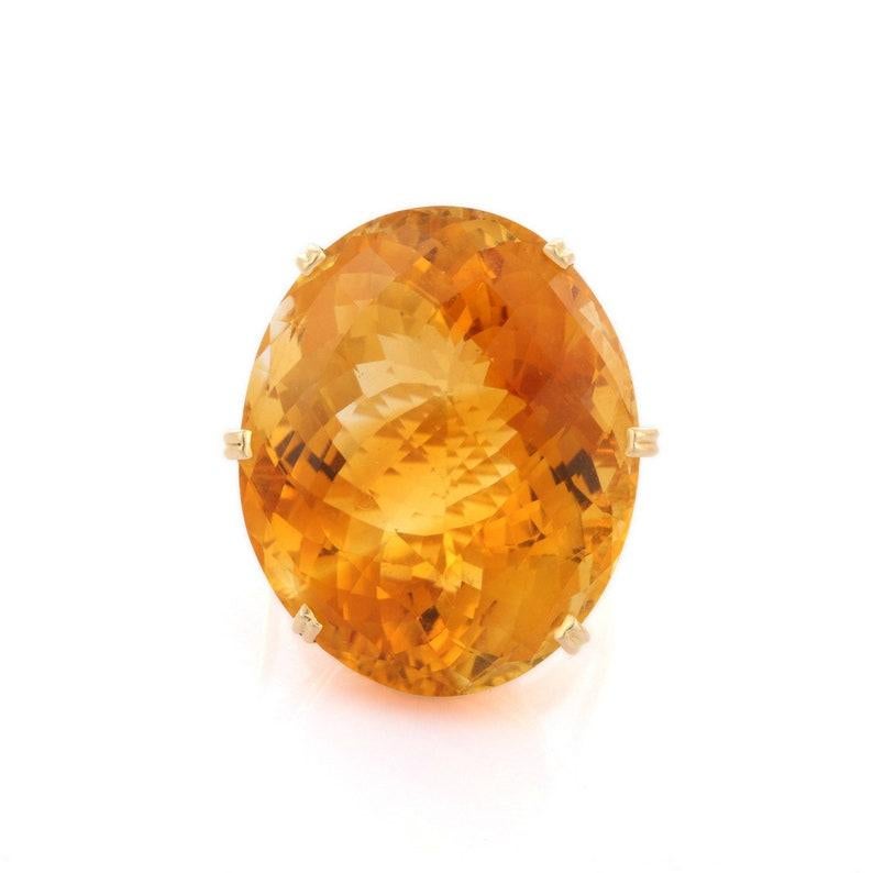 Citrine Ring in 18K Gold is a perfect statement jewelry to match with every outfit of your wardrobe. It's just a simple ring and simplicity is the ultimate form of sophistication. 
Designed with a big oval cut citrine in center that makes it a
