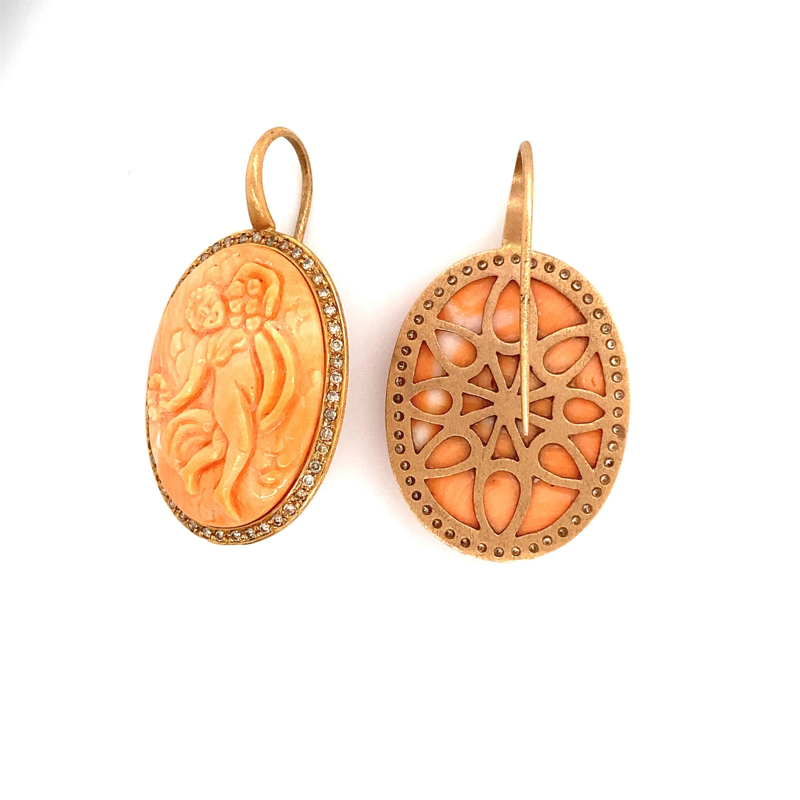 18 karat Yellow Gold and Diamond Cameo Coral Earrings 

Cameo engraved with my hands in a Coral taken up on Yellow Gold 18 carats. The outline of the coral is set with Diamonds. Earrings neck sign