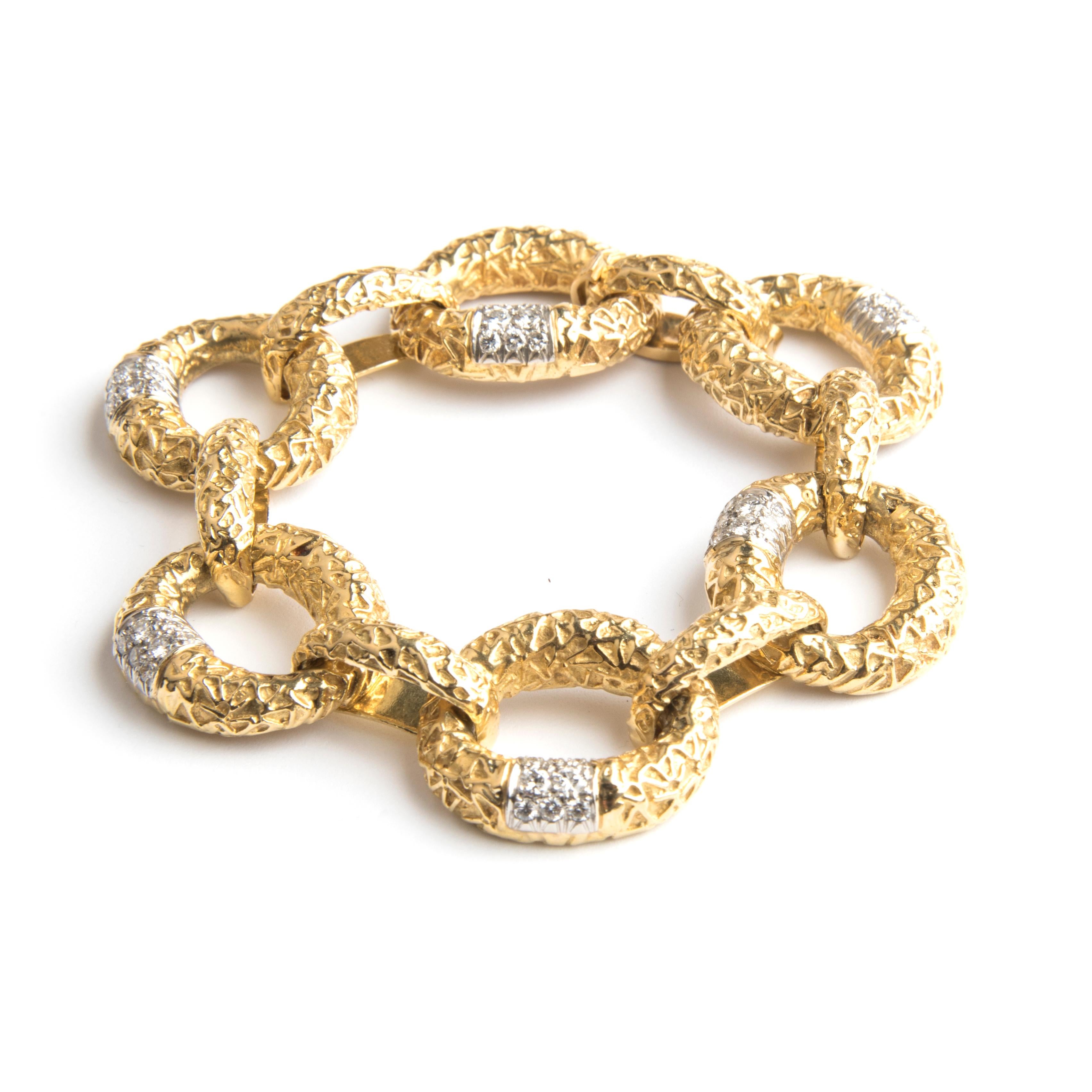 Van Cleef & Arpels 18k yellow gold chain bracelet, compromising 6 large and 6 small links, the large links partially set with diamonds.
Signed VCA NY, hallmark and numbered 57730.
Circa  1960