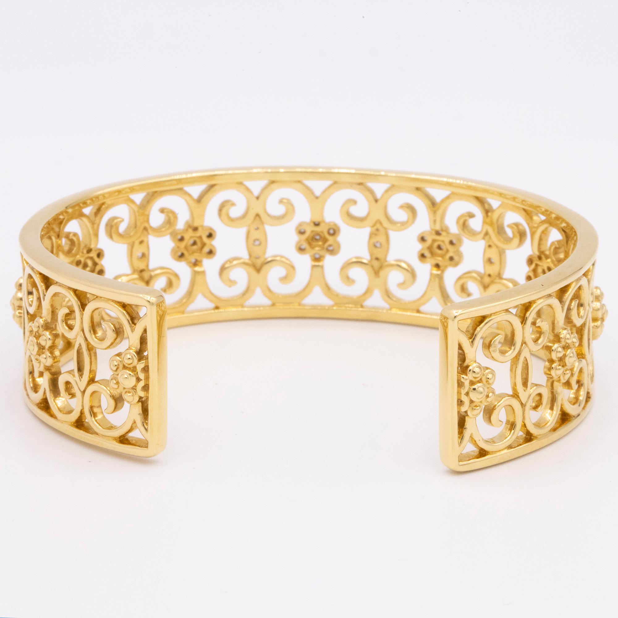 From Hamilton's Arabesque Collection, 18k yellow gold openwork cuff bracelet with 53 round brilliant diamonds, weighing .34ctw. This cuff is 17mm wide. 