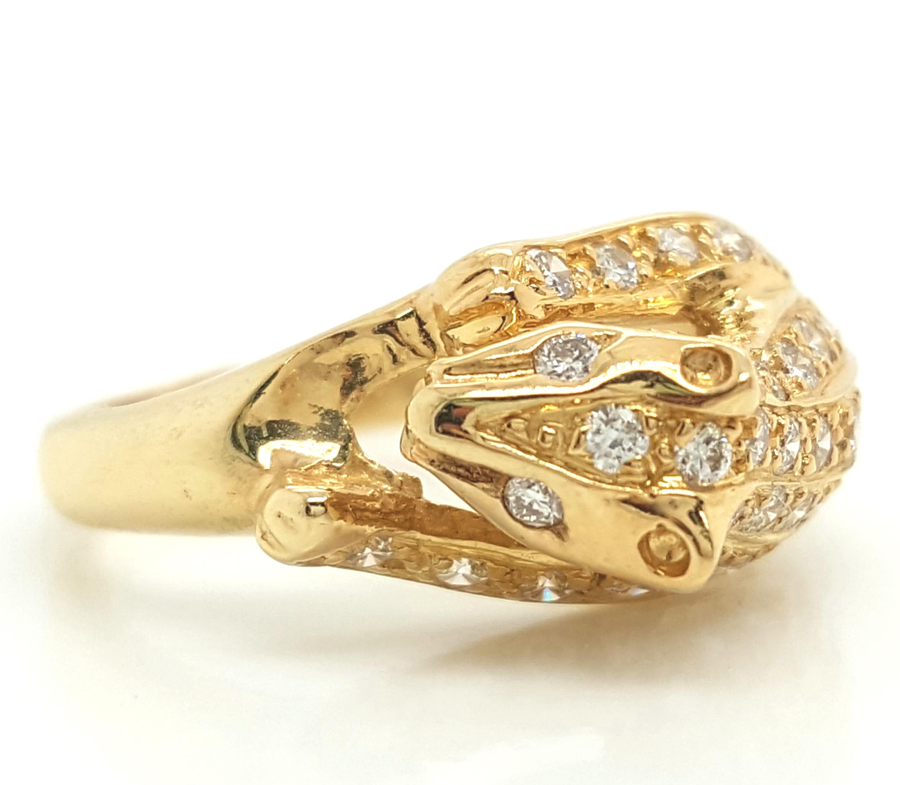 18K Yellow Gold and Diamond Panther Ring.   The ring, designed as a panther, is incredibly detailed and features pave set full-cut diamonds weighing a total of approximately 0.39 carats VS clarity and G - H in color.  The ring weighs 4.49 grams. 