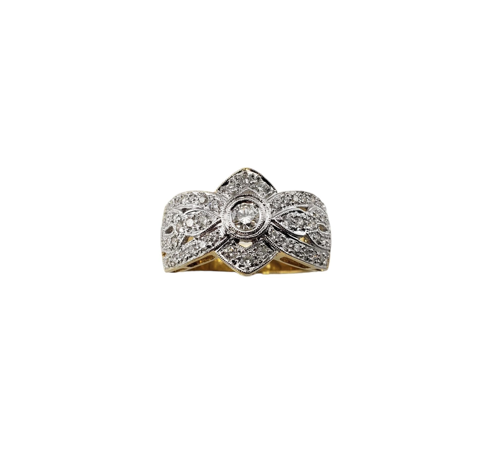Vintage 18 Karat Yellow Gold and Diamond Ring Size 8 JAGi Certified-

This sparkling ring features 53 round brilliant cut diamonds (center: 0.15 ct.) set in beautifully detailed 18K yellow gold.  Width:  13.1 mm.  Shank: 4.6 mm.

Total diamond