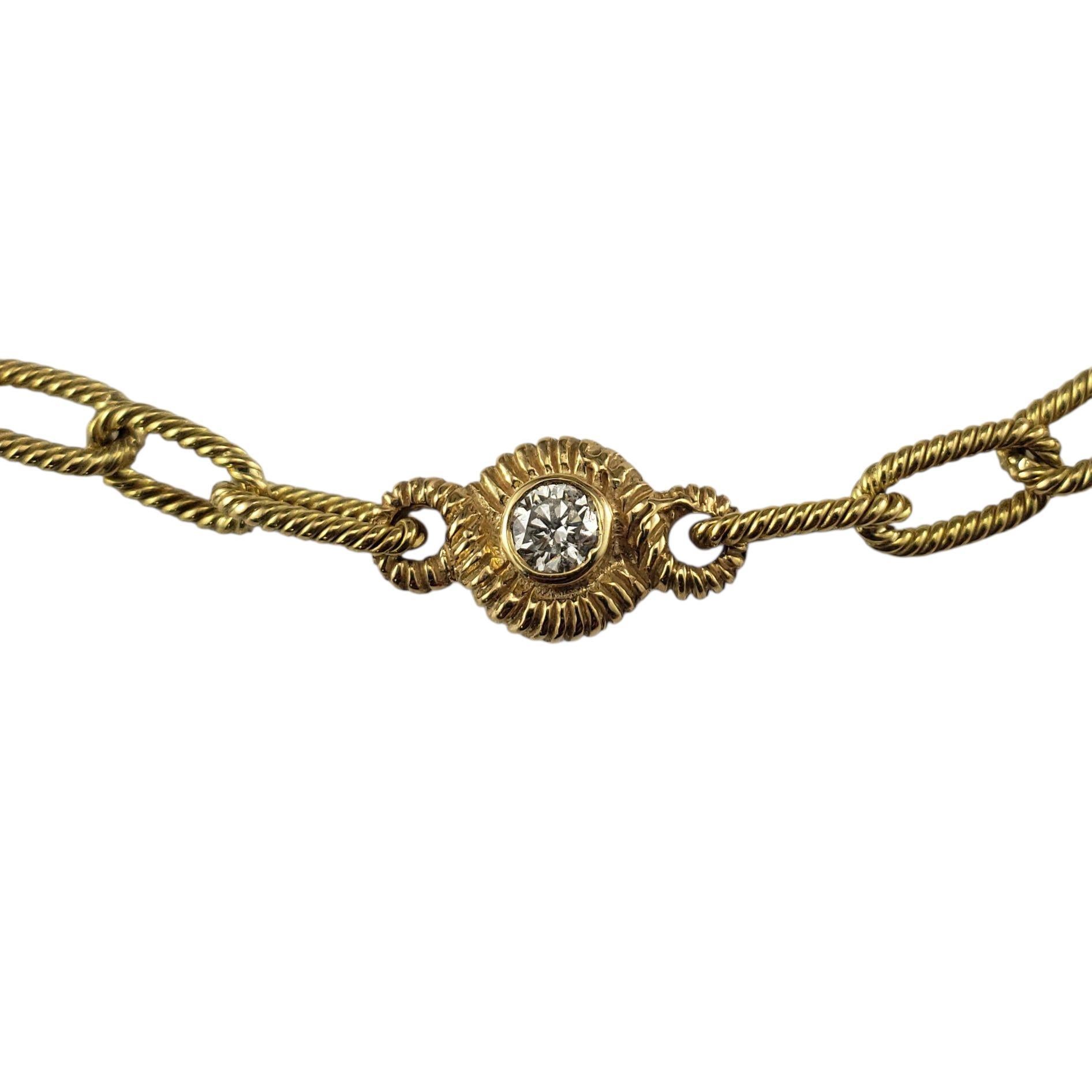 18 Karat Yellow Gold and Diamond Station Necklace-

This spectacular 18K yellow gold link necklace features five stations each with a round brilliant cut diamond on each side for a total of 10 round brilliant cut diamonds. The unique design offers