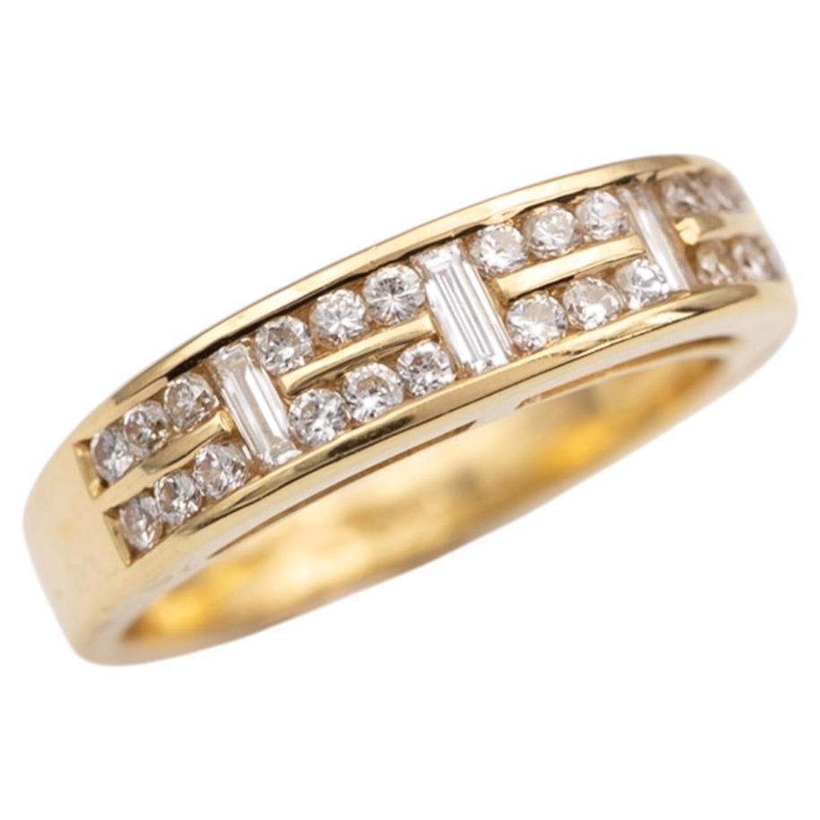 Bague en or jaune 18 carats et diamants, sertissage en rail