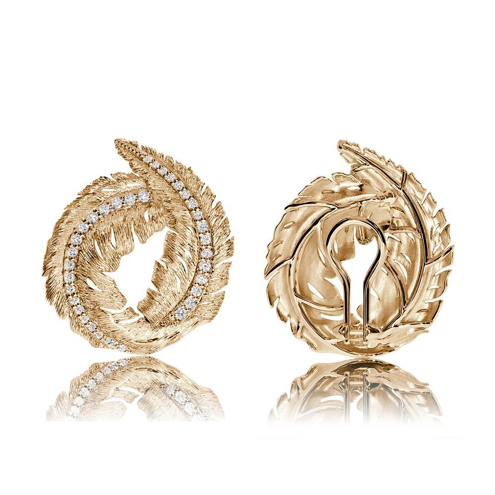 The leaf collection is a beautiful tribute to nature. It features a hand textured finish mirroring the details of the venation of a leaf with diamonds carefully set along the midrib to give a very high end and elegant look in 18K Yellow Gold and