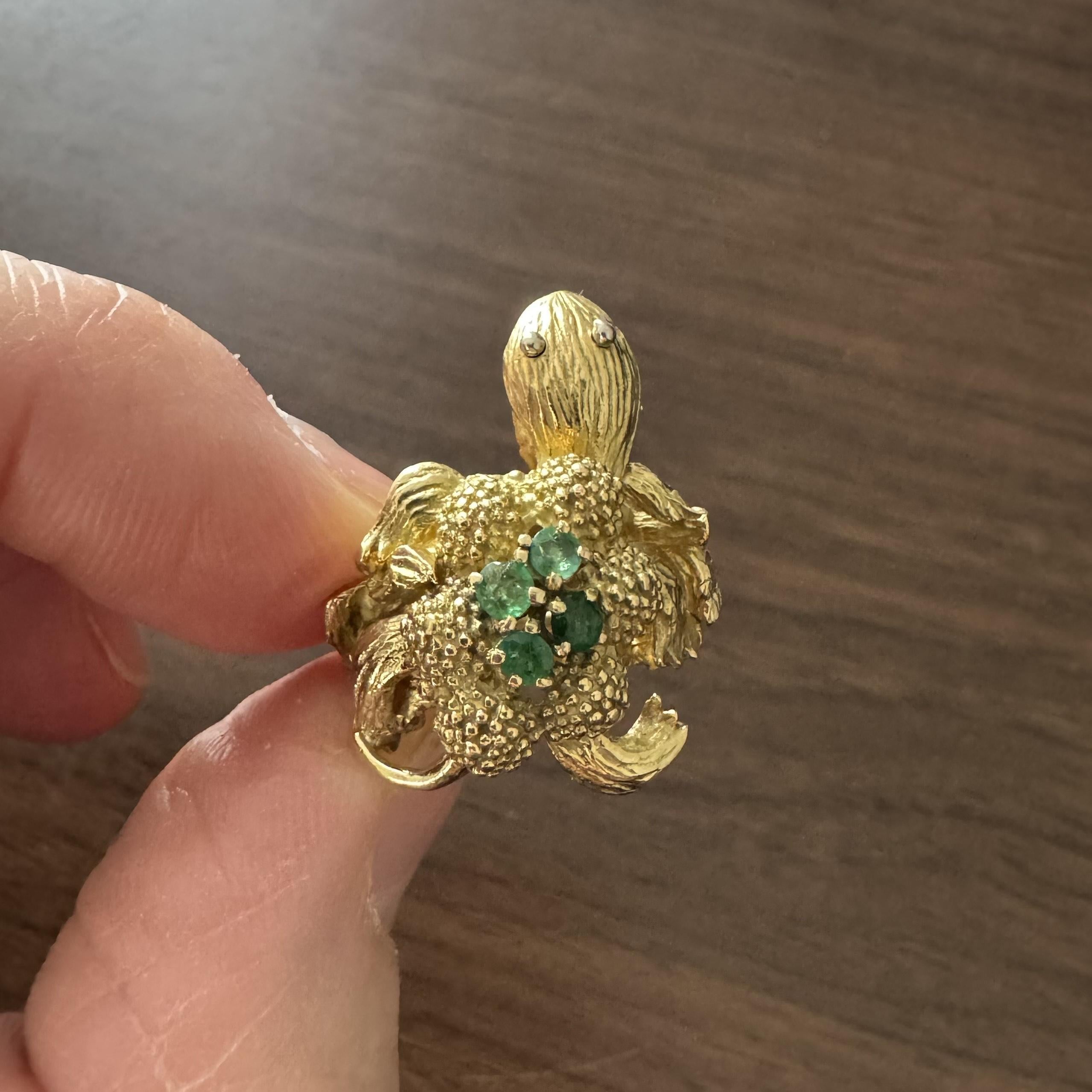 Condition:  Excellent Condition, Professionally Cleaned and Polished
Metal:  18k Gold (Marked, and Professionally Tested)
Weight:  12.8g
Gemstones:  Four Round Cut Emeralds
Face Measurements:  26mm by 20mm
Band