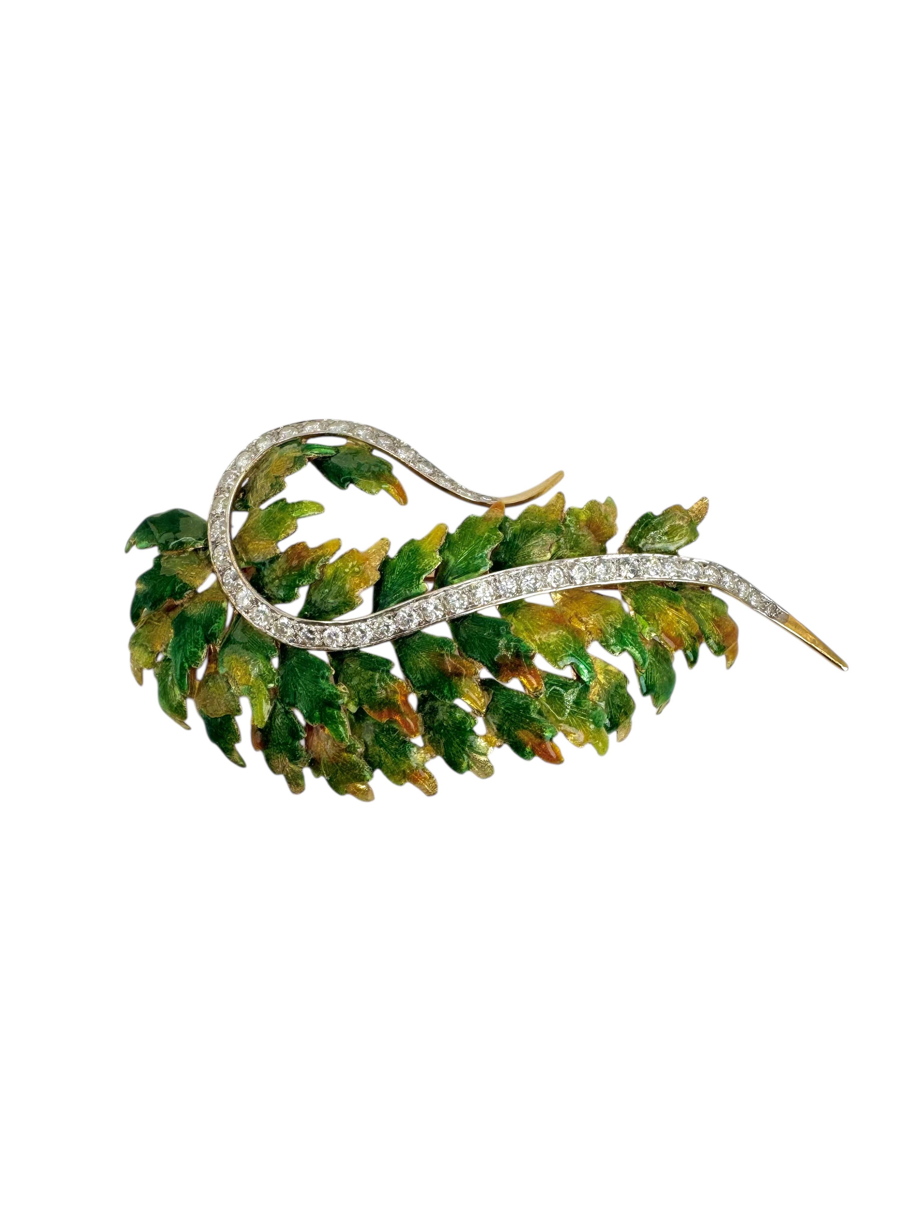 A beautifully crafted mid-century brooch designed as a cascading leaf, featuring intricate green and amber-toned enamel work over richly textured yellow gold. The organic form is elegantly enhanced by a sweeping vine set with 26 sparkling round