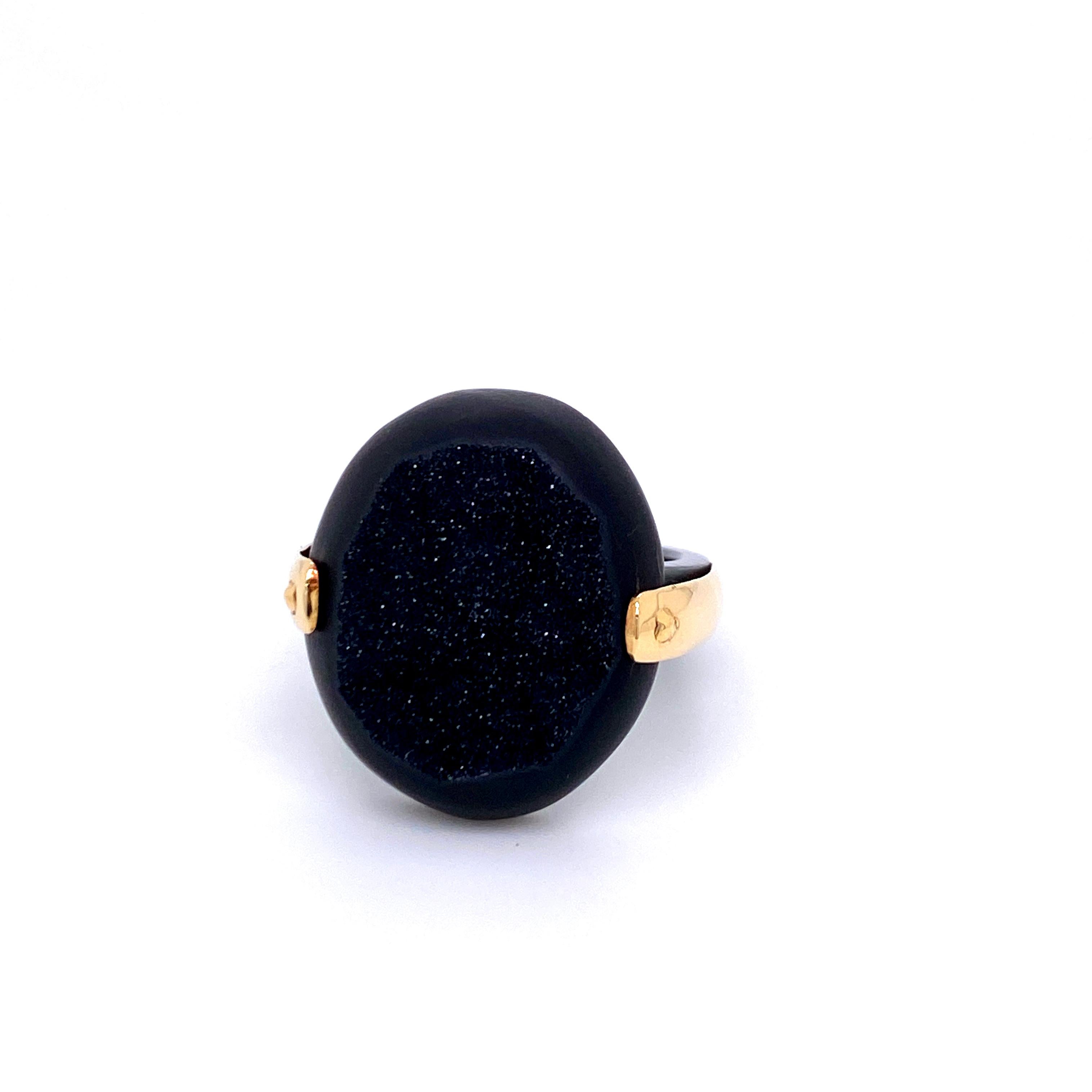 An 18k yellow gold and oxidized sterling silver ring featuring one oval black druzy 19mm X 22mm. This ring is a size 7.5. Designed and made by llyn strong.