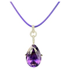 Pendentif en or jaune 18k et platine avec améthyste