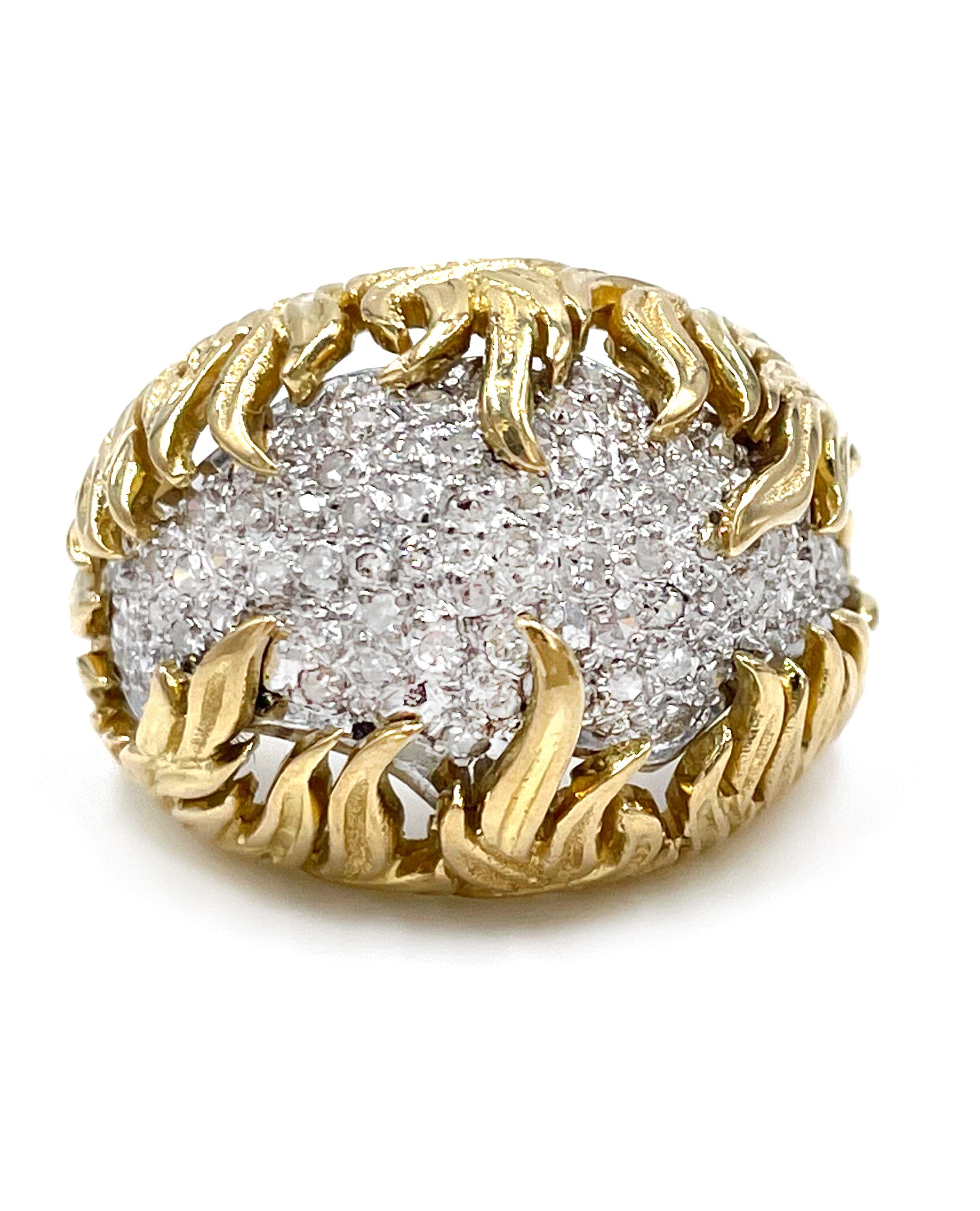 Preowned 18K yellow gold and platinum diamond dome ring The yellow gold body is inset with a platinum
plate, pave set with 68 round single cut diamonds with an approximate total weight of 0.68 carats.

* The diamonds average I color, SI2 clarity.
*