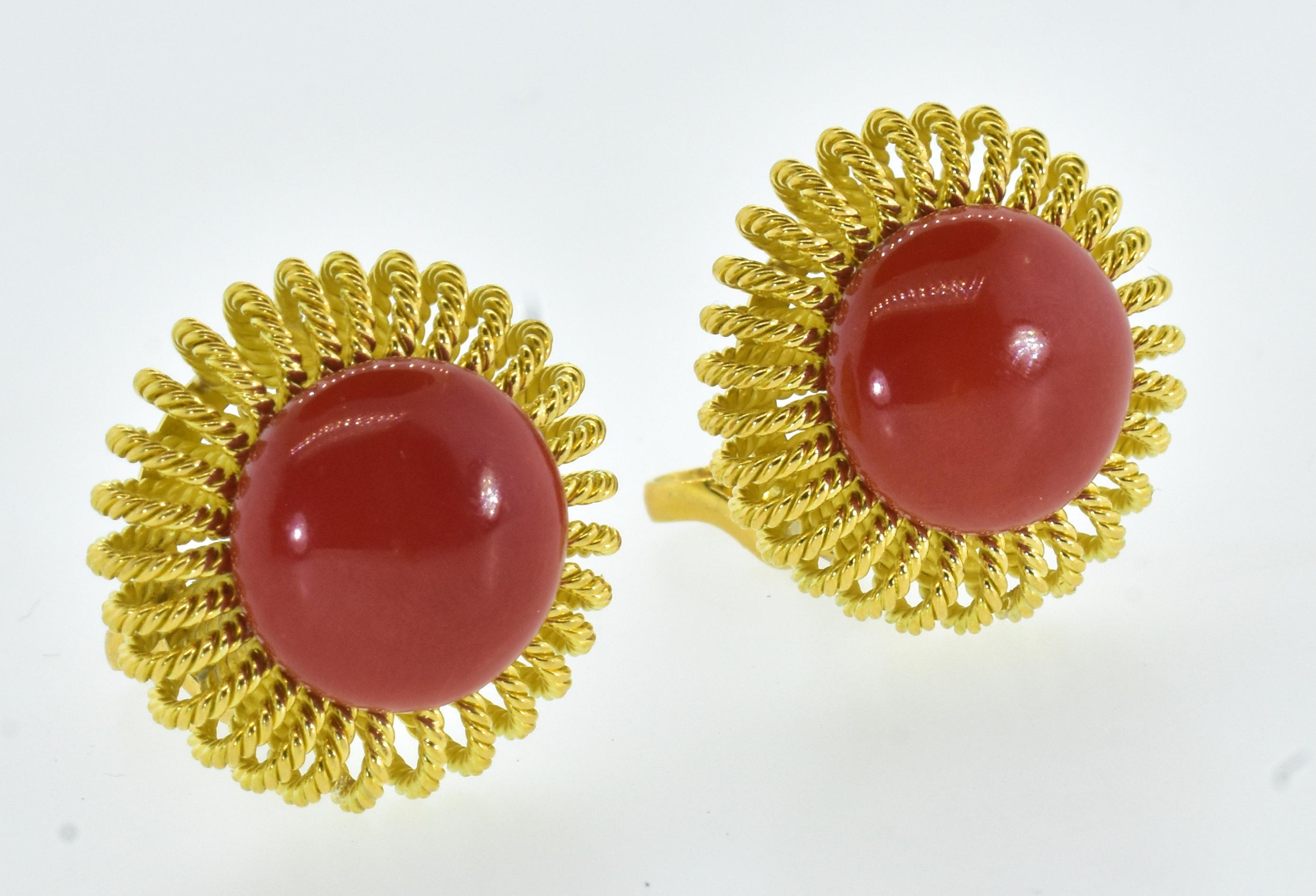Red coral and 18K yellow gold vintage  The earrings:  from deep, likely Mediterranean waters comes an excellently matched pair of button shaped corals measuring 15.3 mm. set in 18K yellow gold weighing 27.54 grams.
These are also superly matched. 