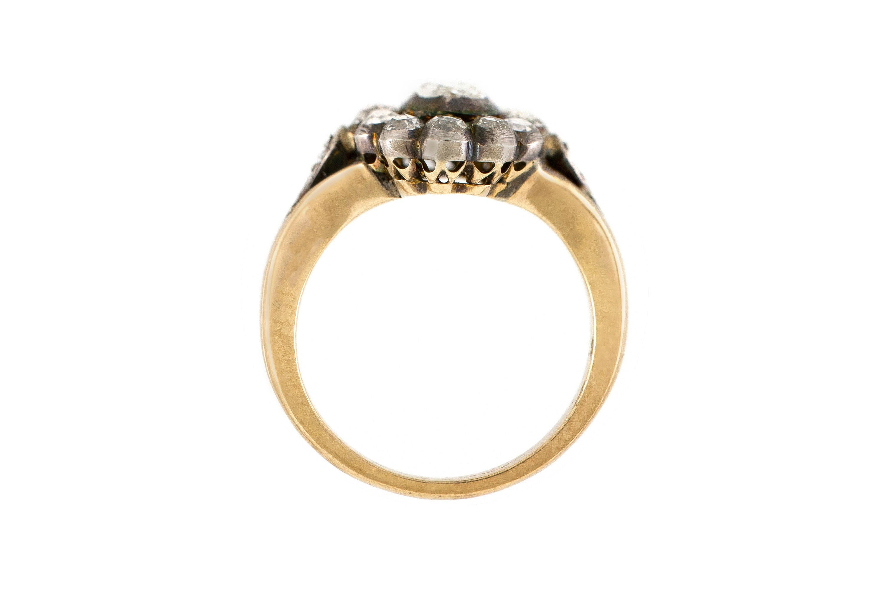 The ring is finely crafetd in 18k yellow gold and silver with rose cut diamonds weighing approximately total of 2.20 carat.