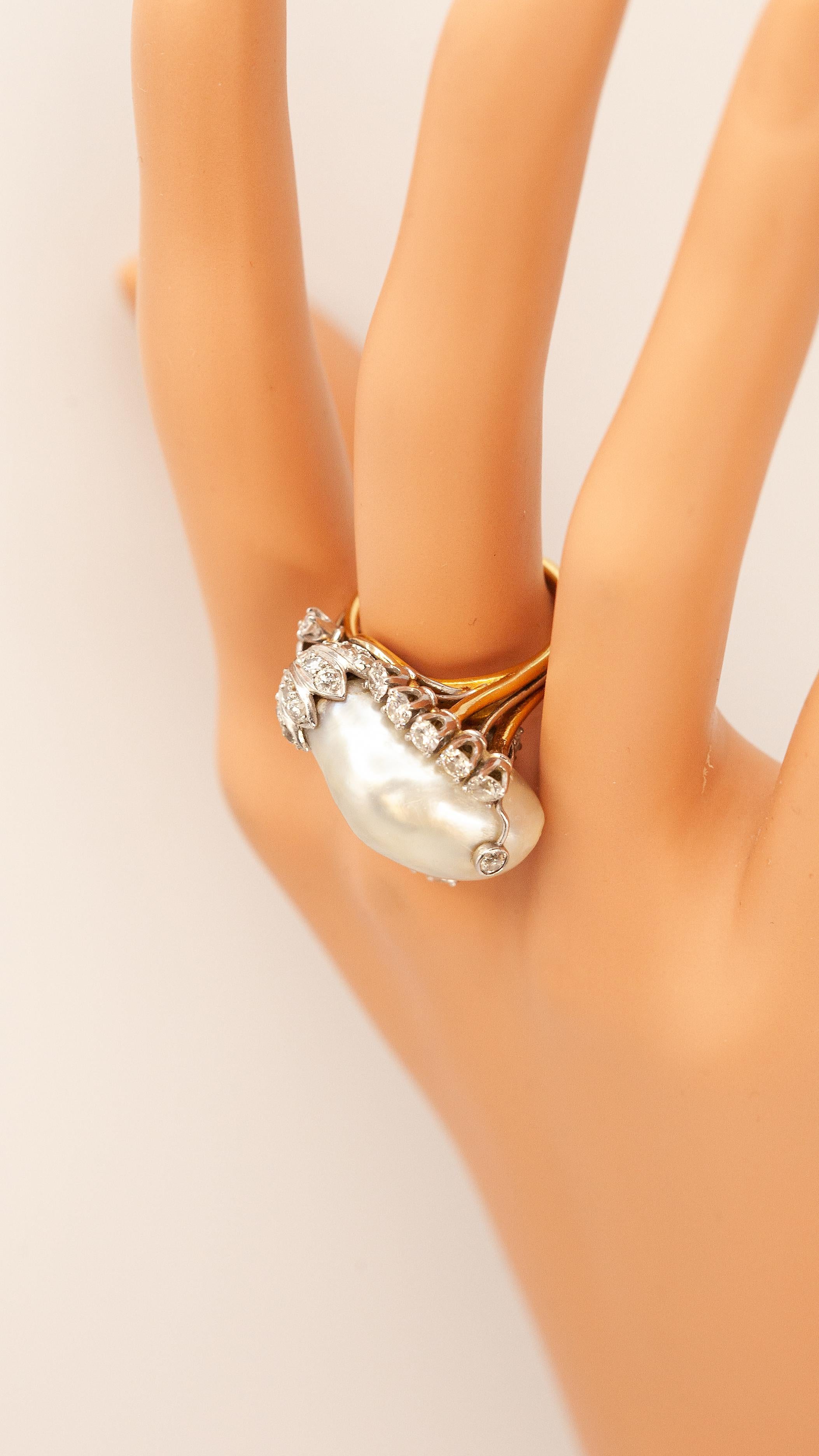 18K yellow gold and white gold diamond GIA certified natural pearl ring with 30 old European cut, round cut and single cut diamonds approximate 1.44 carats in G-H color VS-SI clarity and 1 large natural pearl 

Ring Size: US 6.5

Approximate Weight: