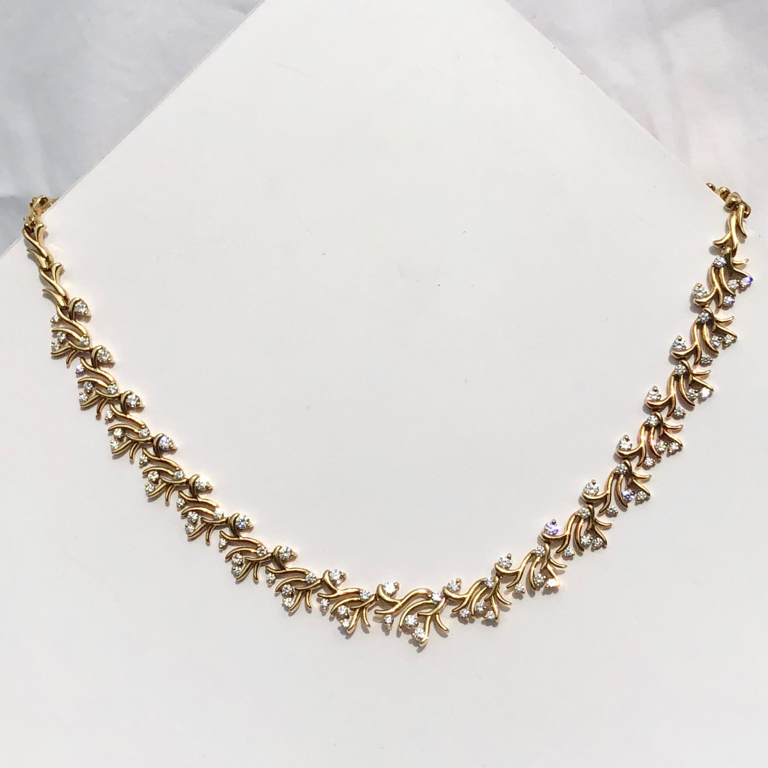 In 18k Yellow Gold and Diamonds 
This Yellow Gold Collar By The Highly Awarded Designer José Hess
The Gently Scrolling Artfully Sculptured Folate Yellow Gold Intersected With Exceptional Quality White Round Brilliant Cut Diamonds.

Total Diamond
