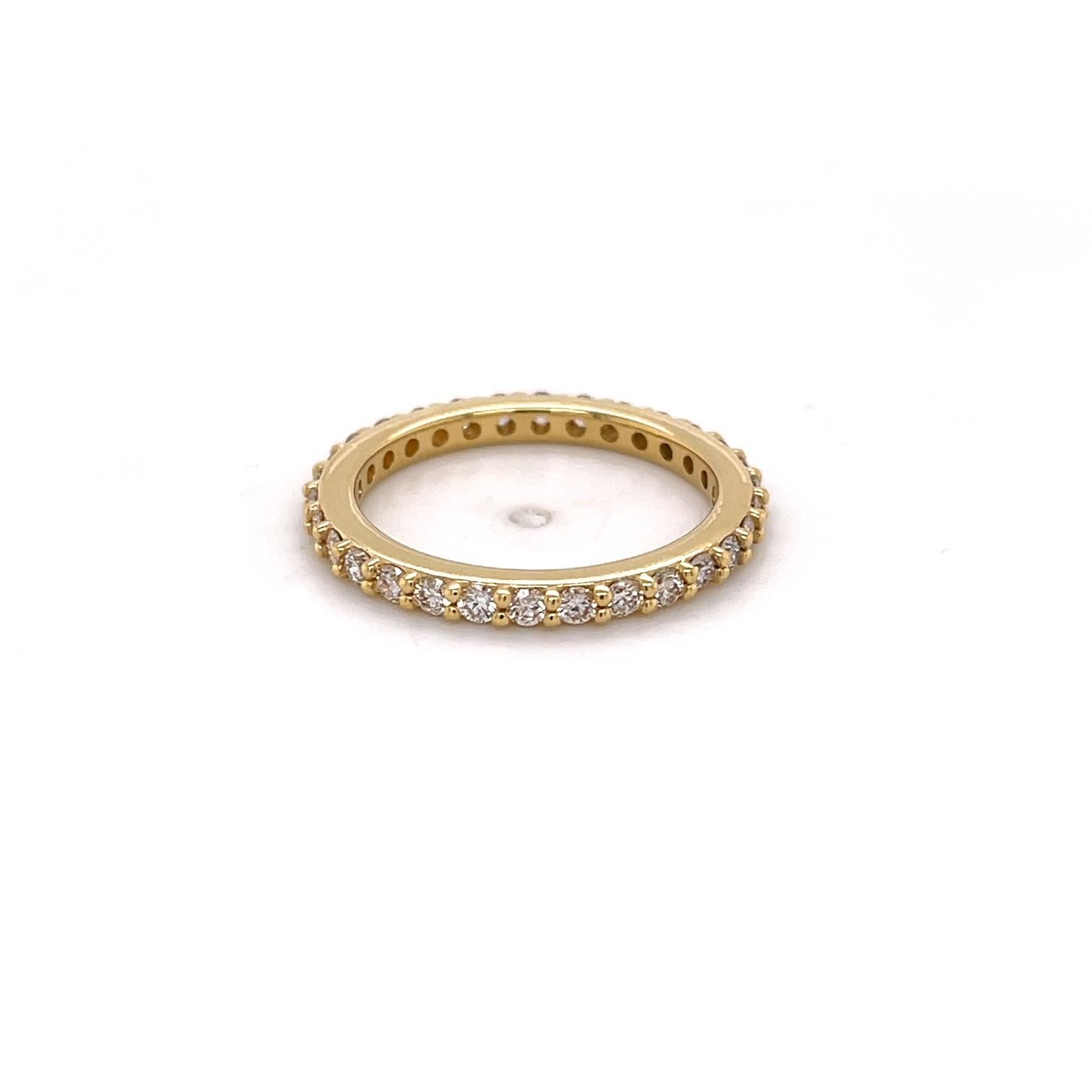 An 18k yellow gold anniversary band set with 30, 2mm top light brown diamonds for a total of .9 carats. This ring was made and designed by llyn strong.
This ring can be made into any size - price may vary.