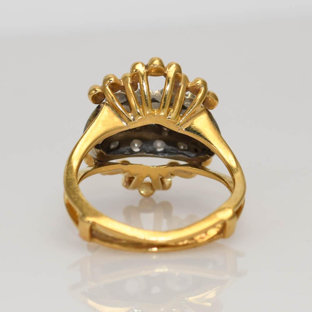 18k Yellow Gold Antique Diamond Ring 
There is one Round Brilliant cut Diamond, .30ct VS1-VS2 Clarity, I-J-K Color.
Also, a .40ct Old Euro Cut Diamond, SI1-SI2, L-M-N
with an additional .30ct of smaller single cut accent Diamonds.
Clarity SI1-SI2,