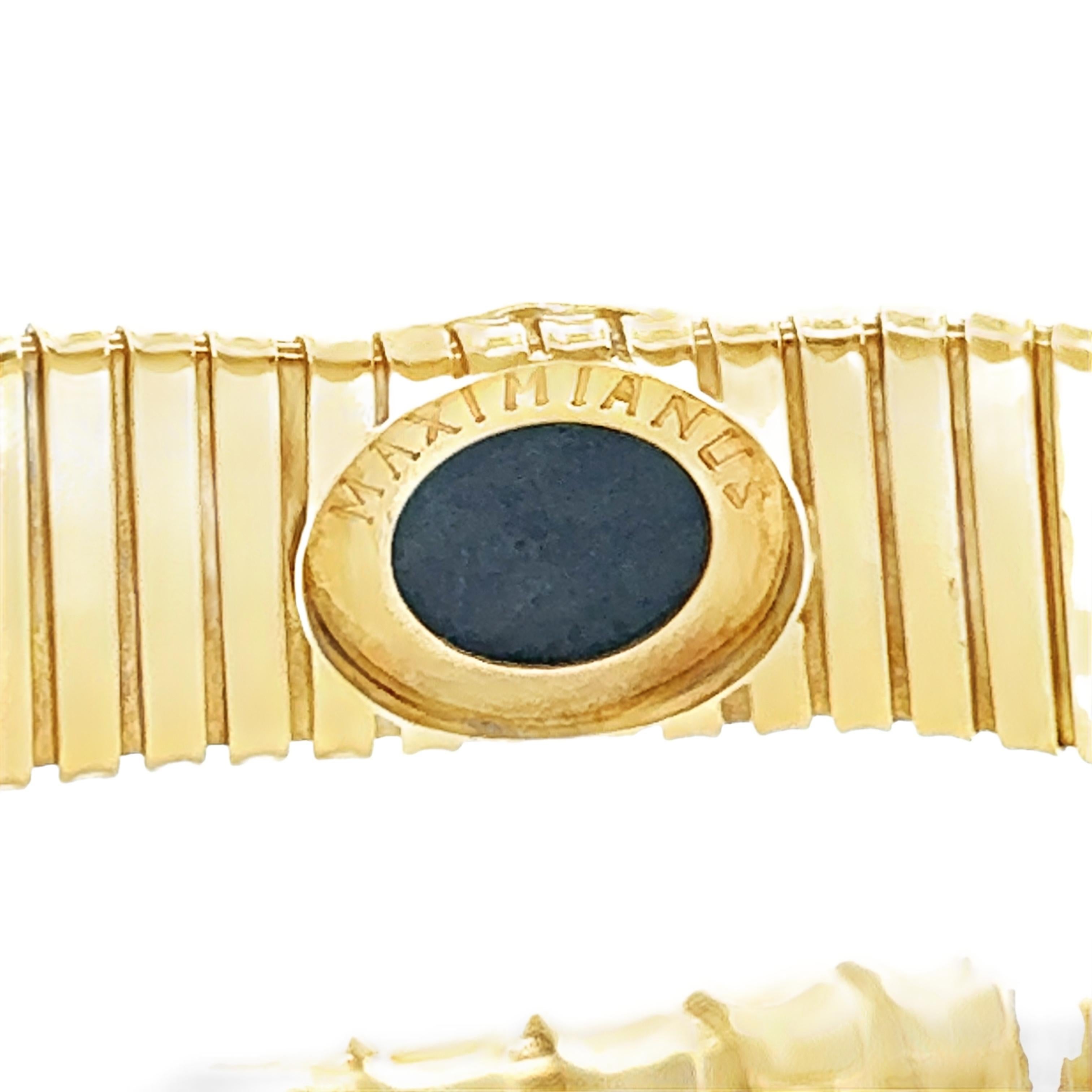 This unique 18K yellow gold tubogas necklace is a true collector’s piece, featuring an antique Roman bronze coin as its captivating centerpiece. Measuring 14.5 inches in length and a bold 25 mm wide, the necklace embodies the luxurious aesthetic of