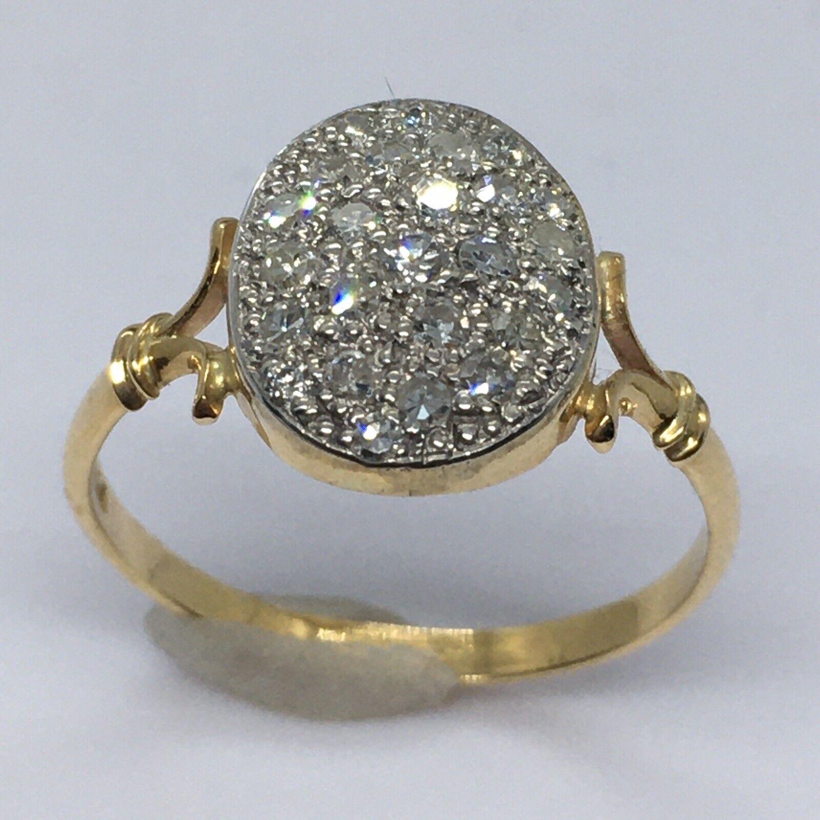 
18k Yellow Gold Antique Silver Top 1/2 Carat Diamond Pave Set Ring 

100 yrs of age
 Size 7.5 +  just a bit over 7.5
Marked 750 tested for 18K
26 pieces of single cut diamonds 1/2 carat total
weighting 2.5 gram 
1/2 inch span on top
Split shank