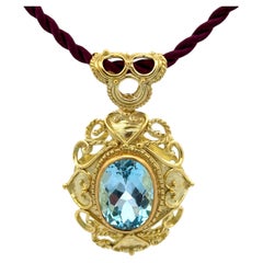 Pendentif aigue-marine en or jaune 18K sur corde de soie violette
