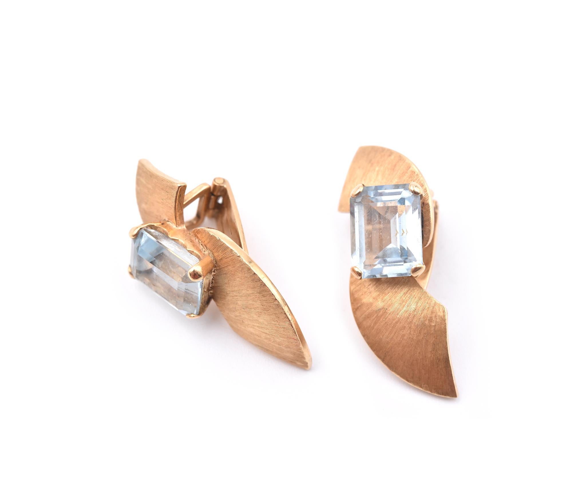 Designer: custom design
Material: 18k yellow gold
Aquamarines: 2 emerald cuts = 5.70cttw
Dimensions: earrings are approximately 10.46mm x 30.32mm
Fastenings: clip-on
Weight: 8.71 grams
