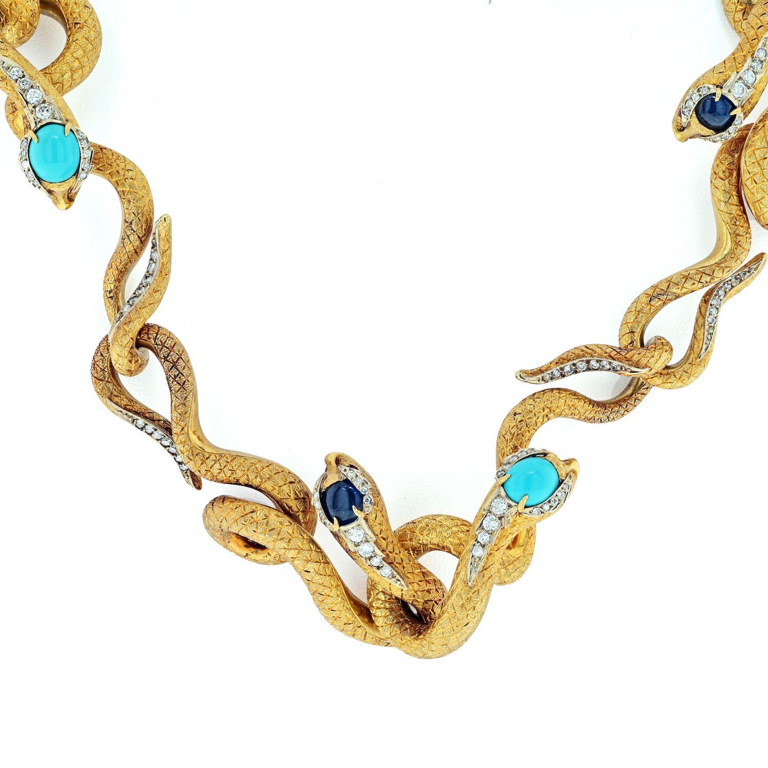 A very unusual 18k yellow gold necklace with articulated snakes. A significant necklace in weight it is 315  in grams. 

Full circle there are 14 handmade snakes with ruby eyes, turquoise or lapis atop its head along with accents of diamonds on the