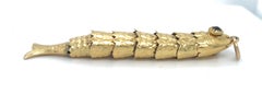 Pendentif poisson articulé en or jaune 18k avec œil en grenat Gorgeous !