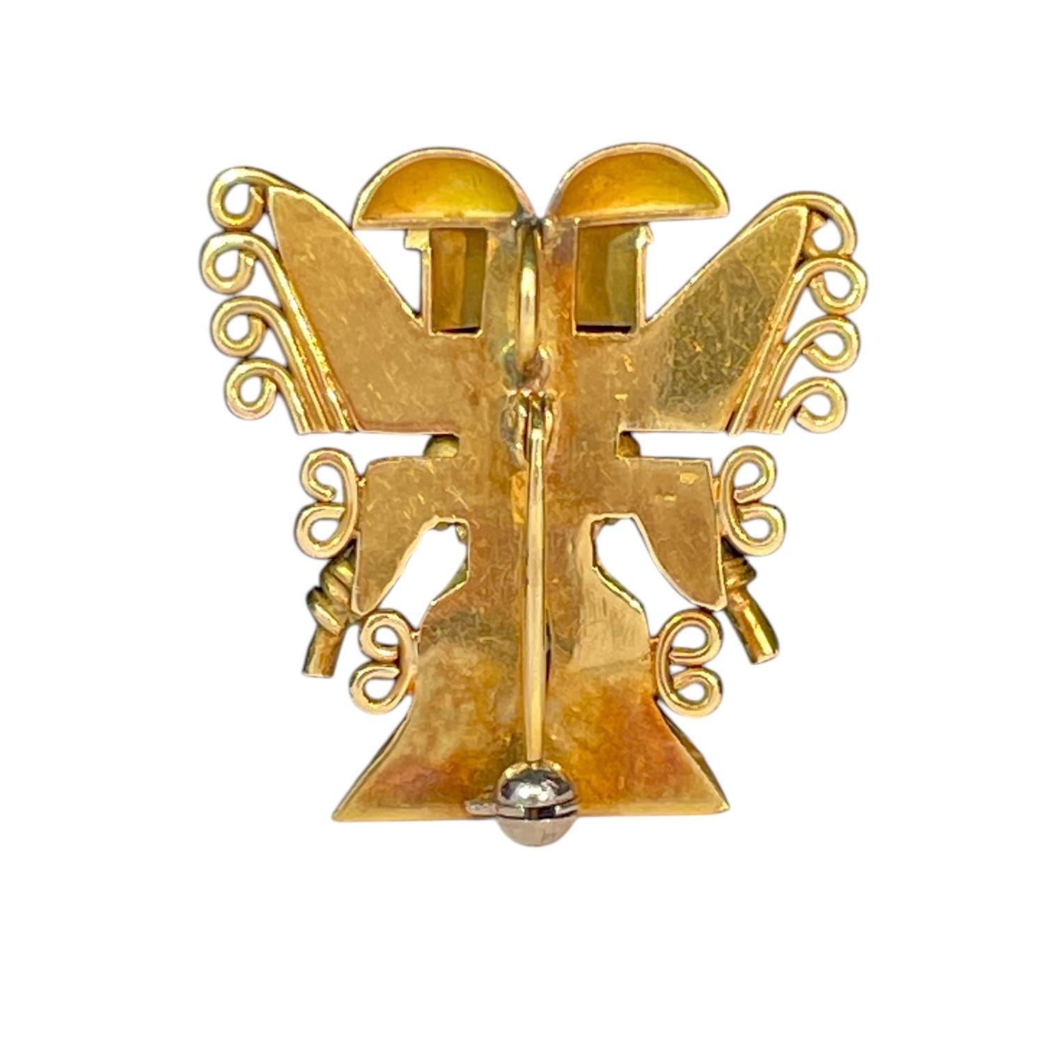 Type: Convertible (brooch/pendant)
Stone : Green emerald
Metal : 18k Yellow Gold
Condition : Good
Weight : 9.1g

A striking piece of artistry, this convertible brooch/pendant is crafted from 18K yellow gold with intricate detailing inspired by aztec
