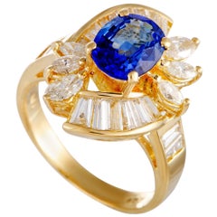 18 Karat Yellow Gold Baguette and Marquise Diamonds and Sapphire Oval Ring 18 Karat Yellow Gold Baguette and Marquise Diamonds and Sapphire Oval Ring