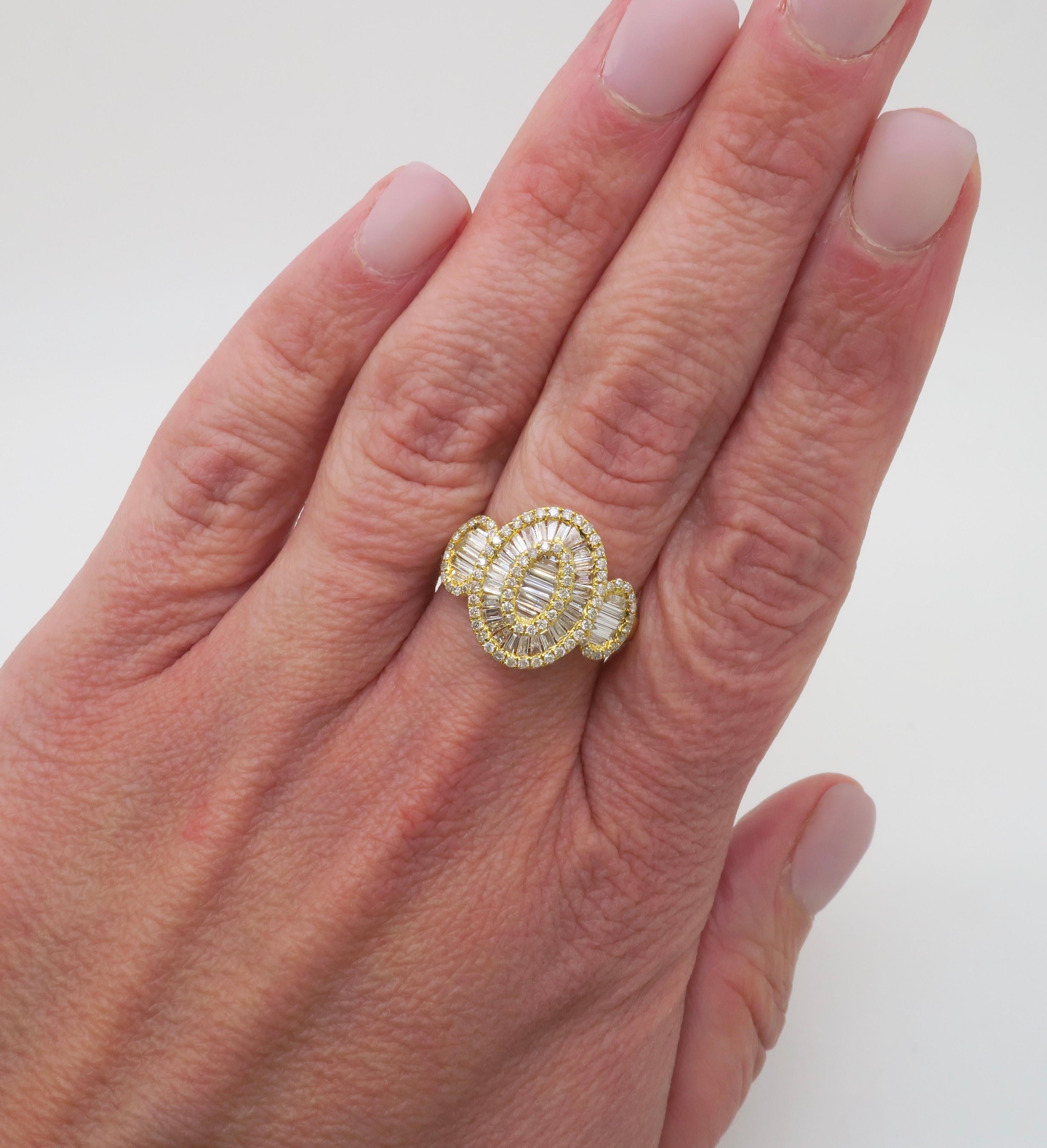 Stunning 18k yellow gold Baguette & Round Brilliant cut diamond ring. 

Diamond Carat Weight: 1.65CTW
Diamond Cut: Baguette & Round Brilliant Cut Diamonds
Color: E-G
Clarity: VS1-SI1
Metal: 18K Yellow Gold 
Marked/Tested: Marked “750