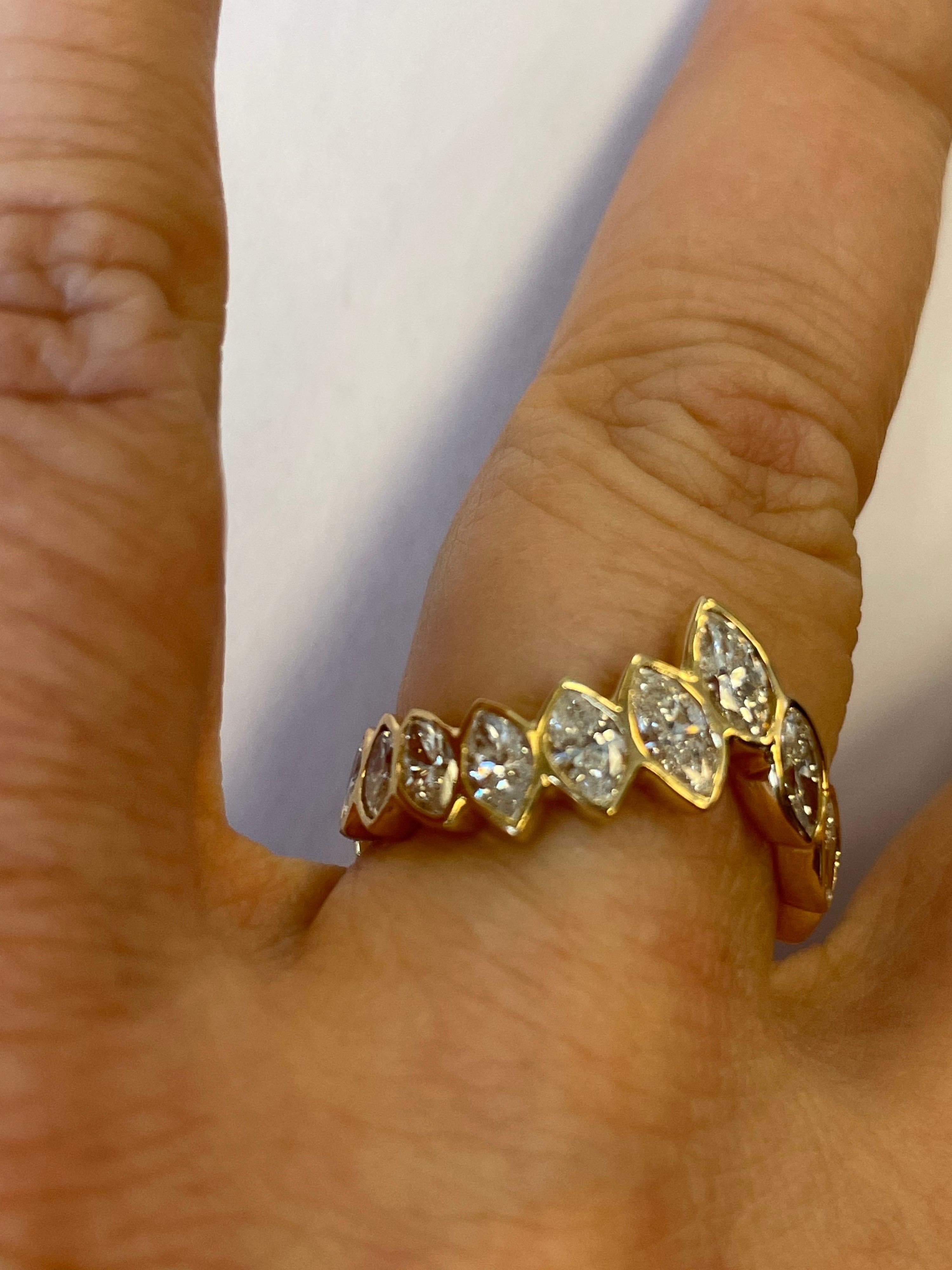 Contemporary 18 Karat Gold Band Ring Set All Around with Bezel Set Marquise Shape Diamonds For Sale