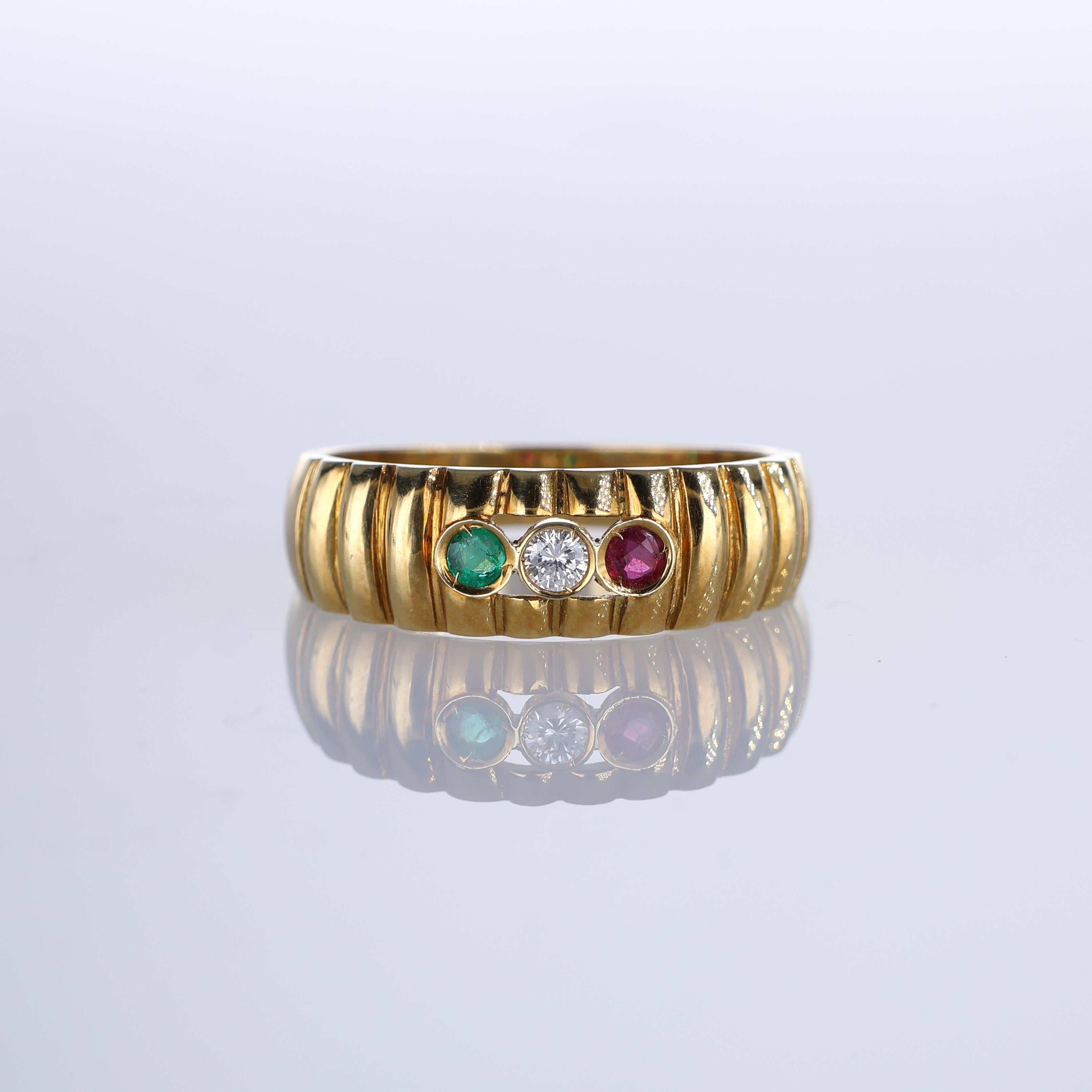 IMPORTANT NOTE:
✔ No additional costs will be added to this order.
✔ Shipping and customs duties are fully covered by us.
--------------------
An elegant 18k yellow gold band ring featuring a striking combination of three precious stones— a central