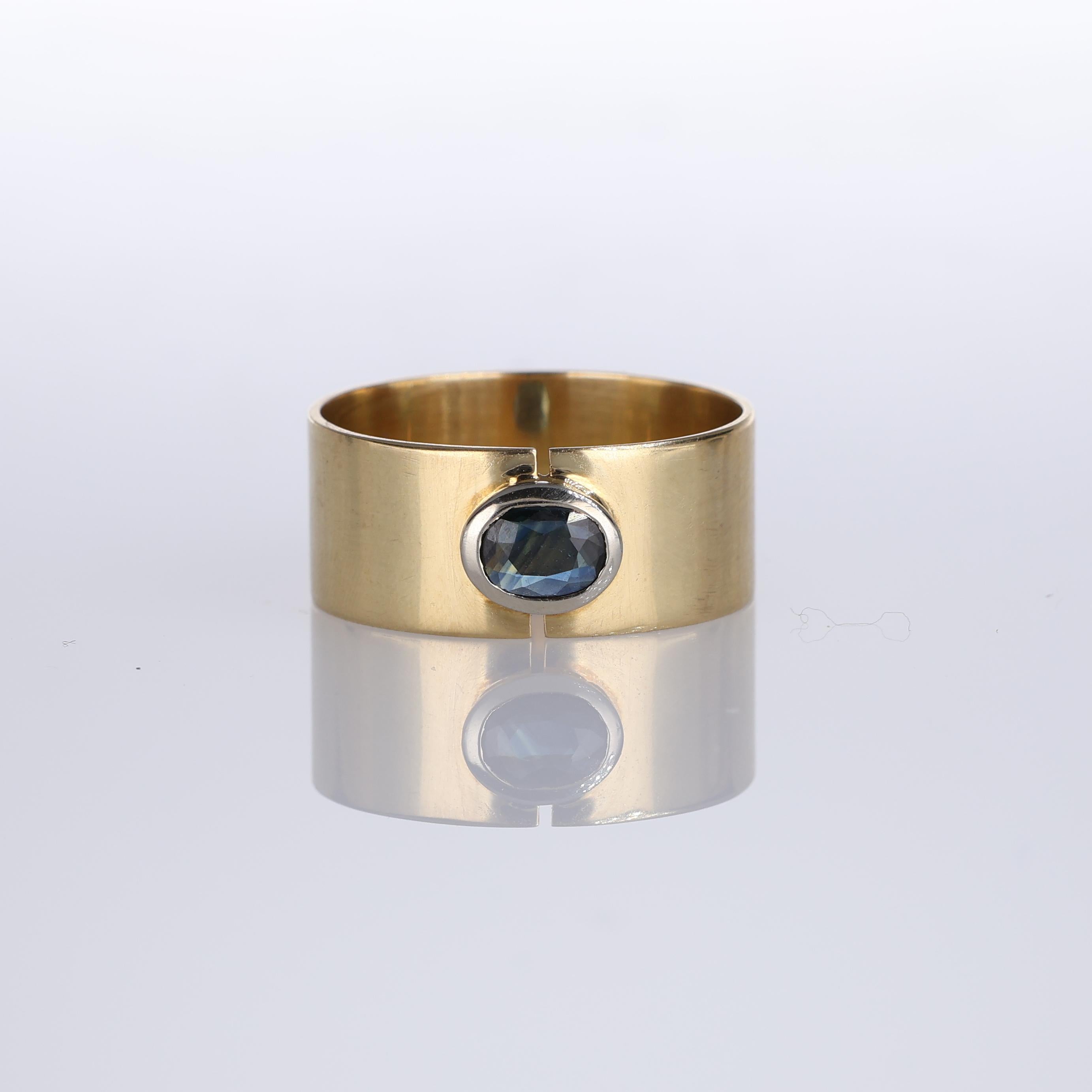 IMPORTANT NOTE:
✔ No additional costs will be added to this order.
✔ Shipping and customs duties are fully covered by us.
--------------------
A minimalistic 18K yellow gold band ring featuring a central oval sapphire weighing 0.20 carats. This