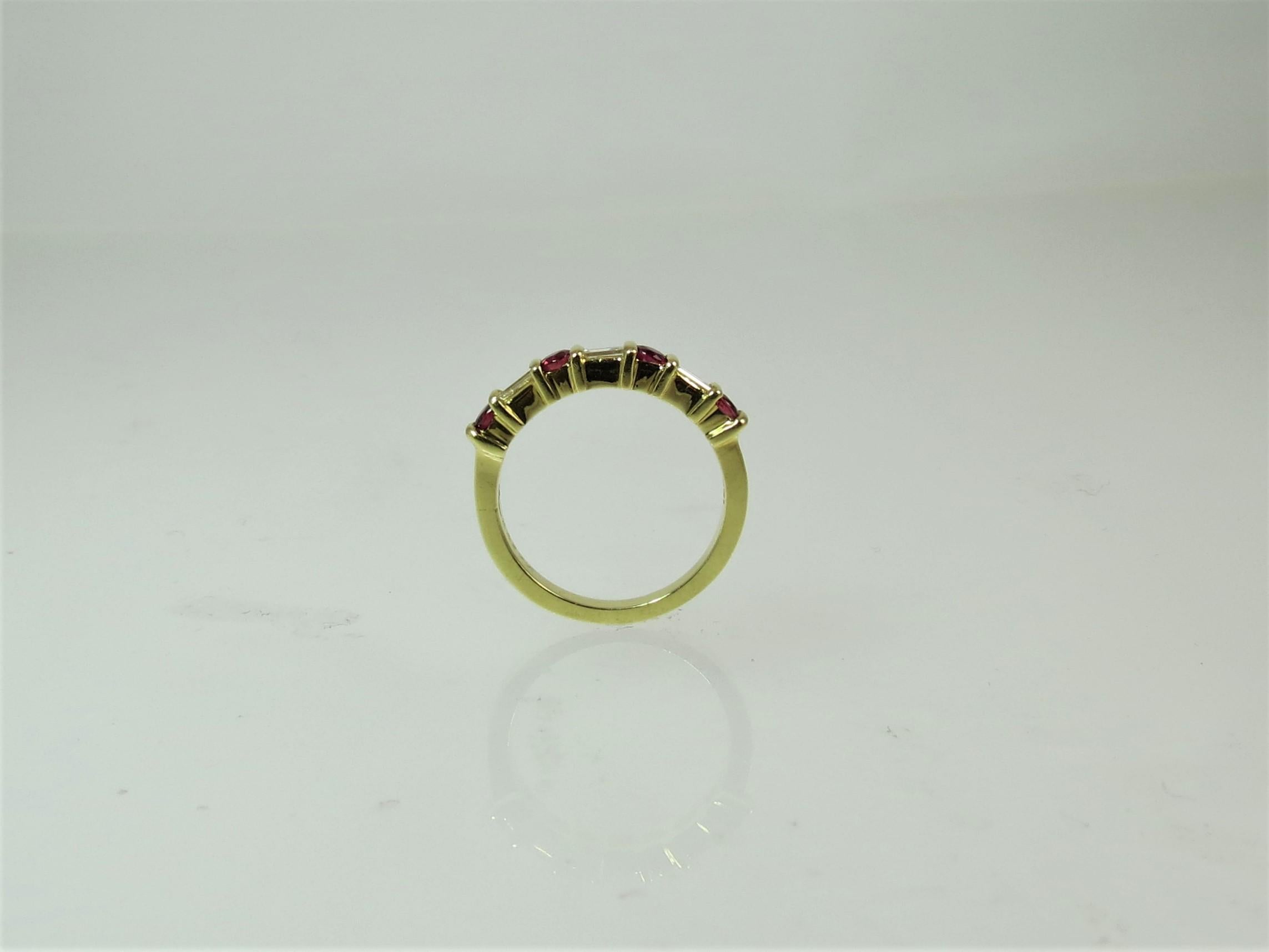 Round Cut 18 Karat Yellow Gold Band Ring with Round Rubies and Baguettes For Sale