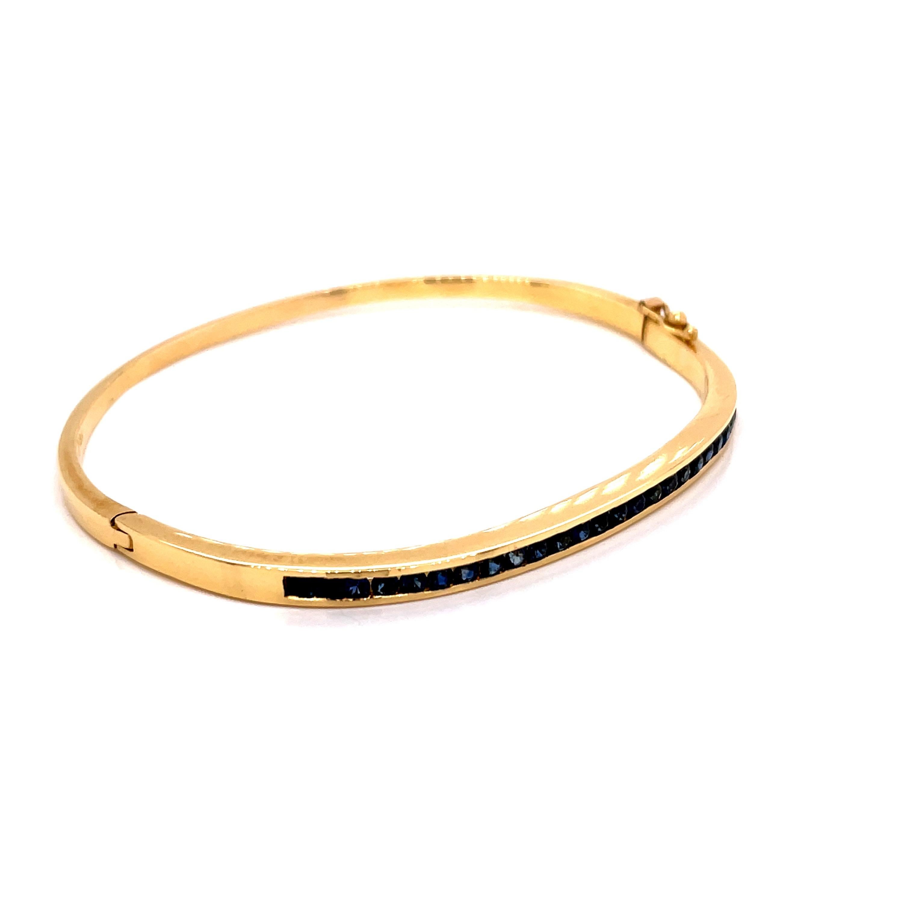Contemporary 18K Yellow Gold Bangle Bracelet Channel Set Sapphires For Sale