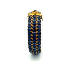 18K Yellow Gold Bangle Bracelet with 75 Carat Oval Sapphire Gemstones