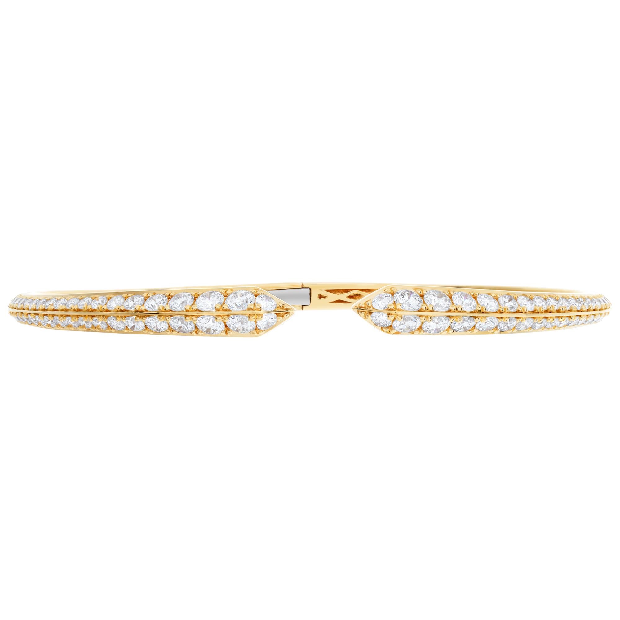 Stunning 18k hinged yellow gold bangle with 2.35 carats in G-H color, VS-SI clarity diamonds. Fits up to 7.5'' wrist
