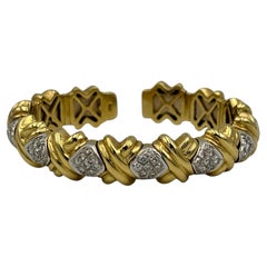 Armreif aus 18-karätigem Gelbgold mit Kreuzmotiv, verziert mit Diamanten, um 1980, Italien