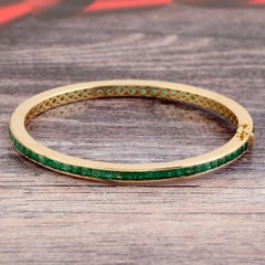18k Yellow Gold Bangle With Emerald Channel Setting