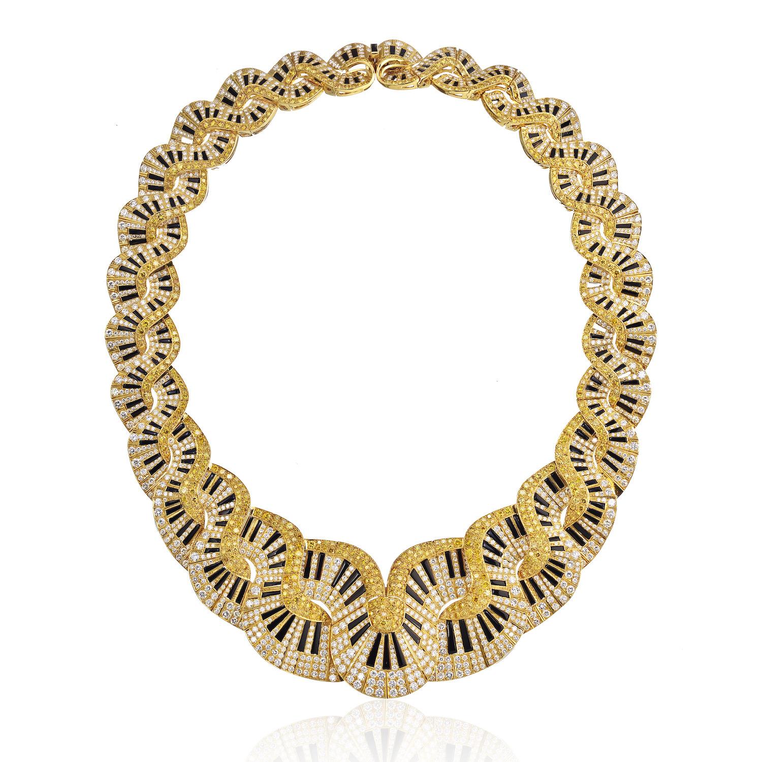 Wearing statement necklaces can enhance your wardrobe and transform your outfits.

Glamorous diamond bib necklace encrusted with white and yellow diamonds with black onyx piano keys. Crafted in 18K Yellow Gold.

This necklace is flat to the neck and