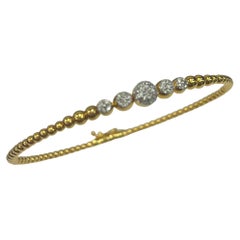 Bracelet jonc en or jaune 18 carats avec perles et diamants