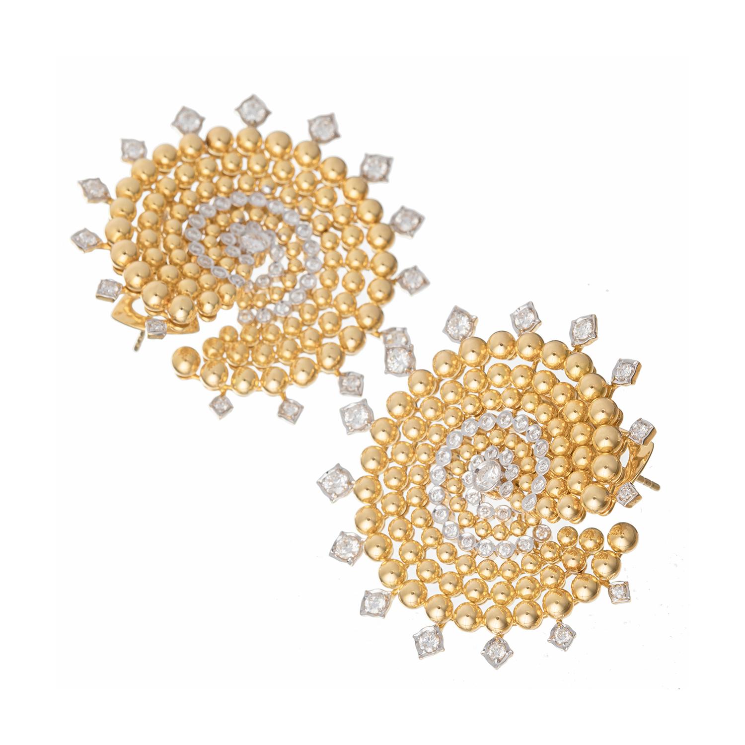 Circular-shaped ear clips, featuring a swirl of graduating polished 18k yellow gold beads with round brilliant-cut diamond accents. Each earring is adorned with fifteen round brilliant cut diamonds on the exterior tips. The centers are each bezel